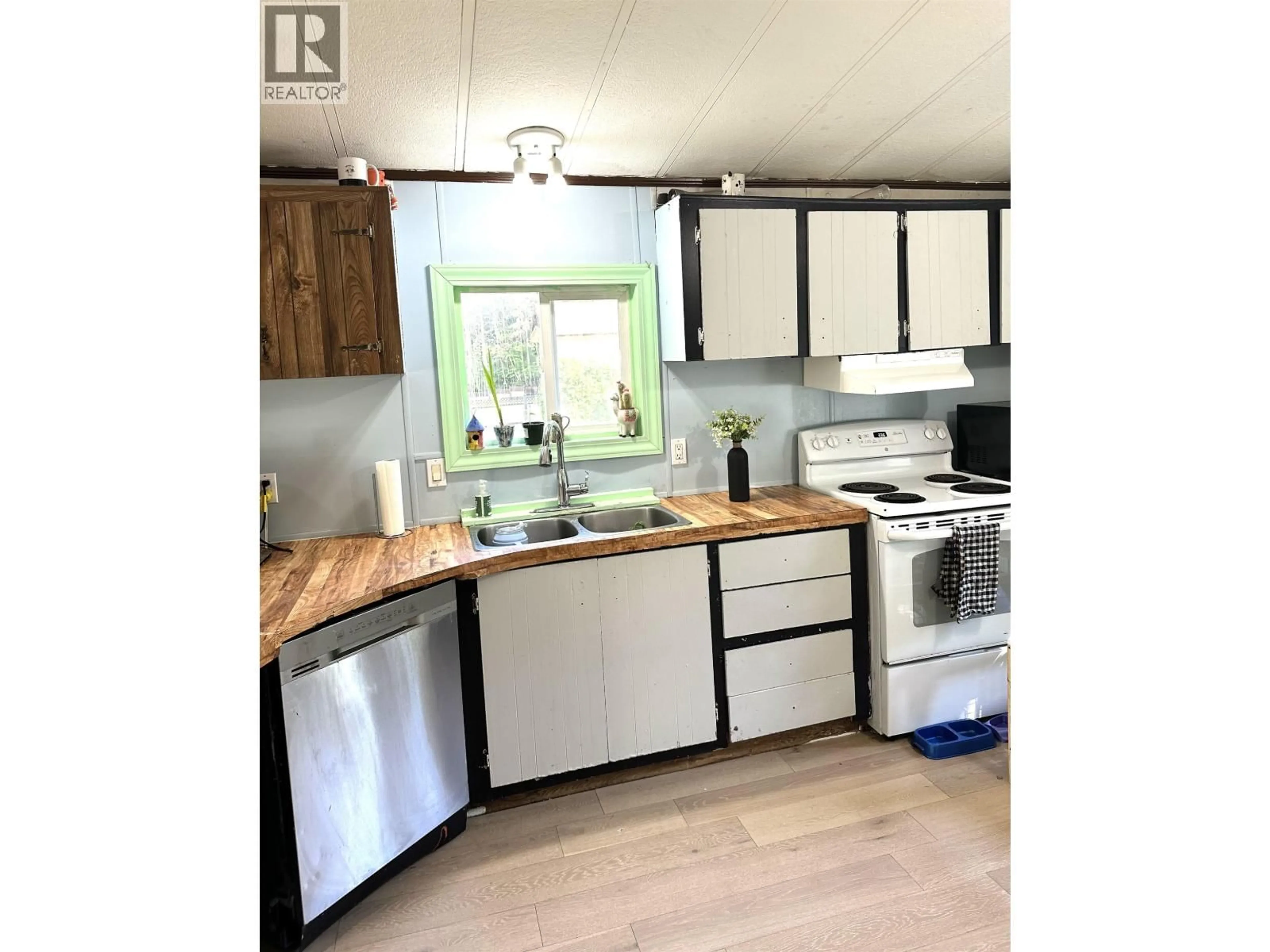 Open concept kitchen, wood/laminate floor for 2020 KENWORTH ROAD, Prince George British Columbia V2K4L8