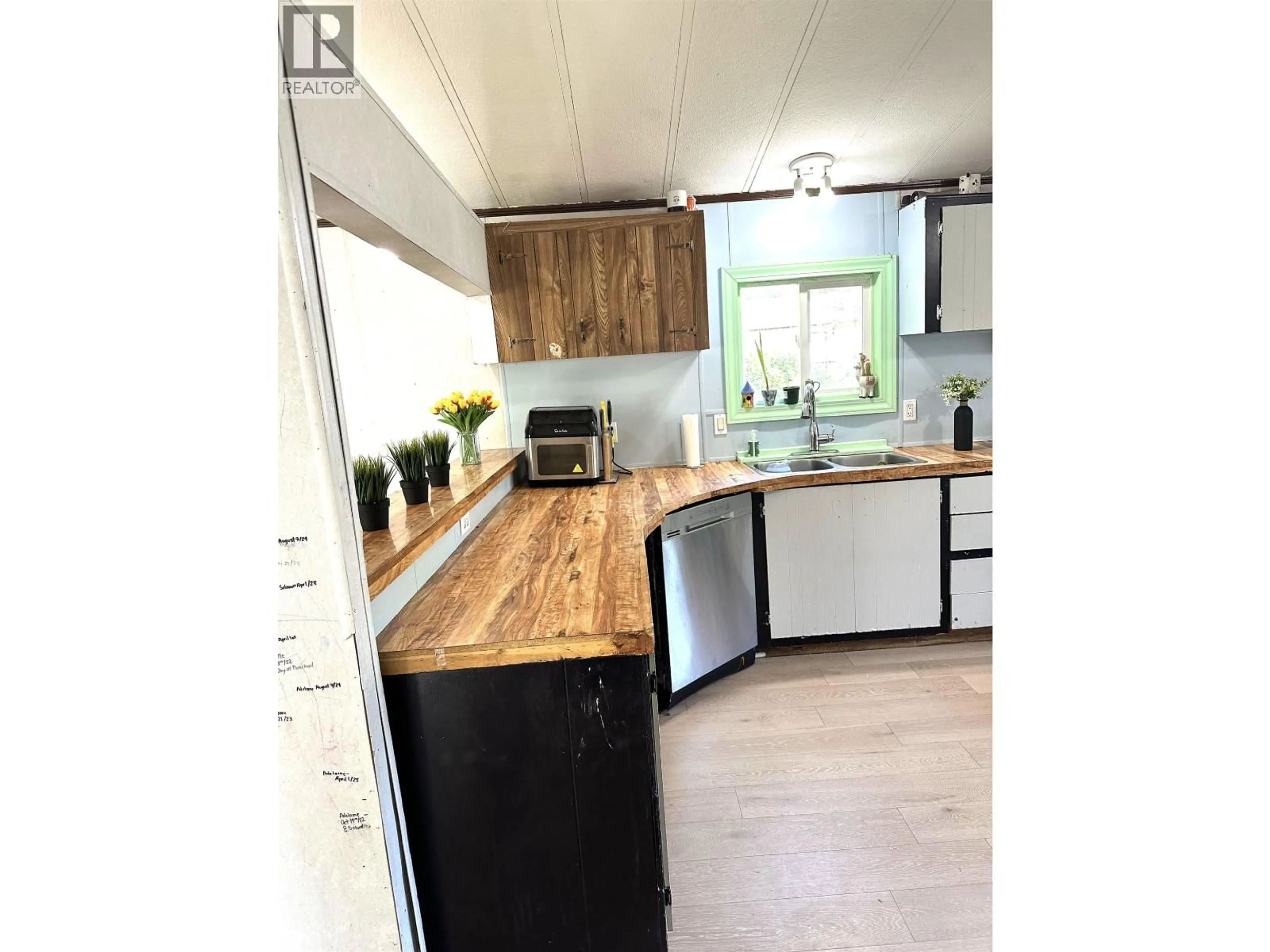 Open concept kitchen, wood/laminate floor for 2020 KENWORTH ROAD, Prince George British Columbia V2K4L8
