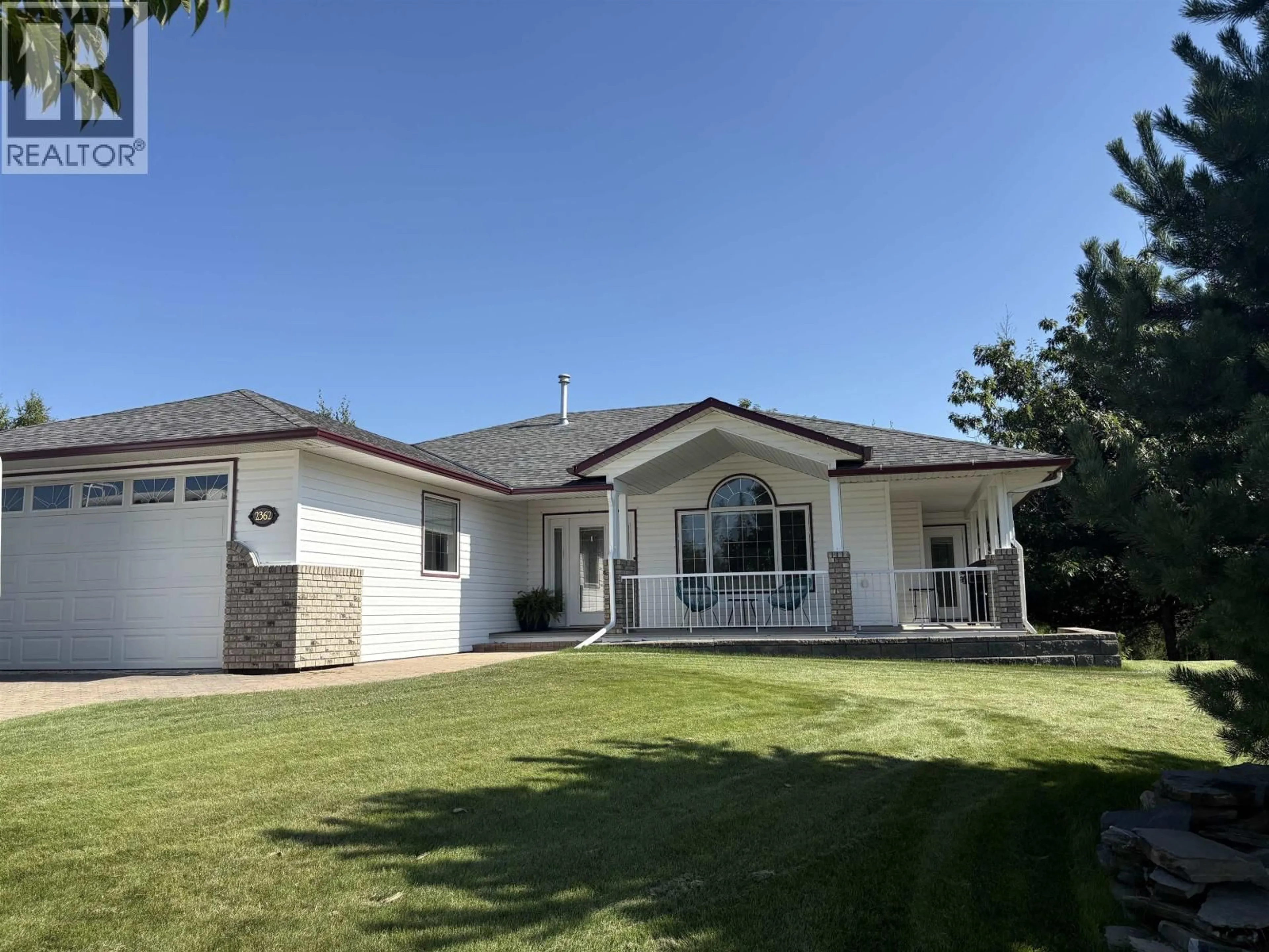 Home with vinyl exterior material, street for 2362 MCTAVISH ROAD, Prince George British Columbia V2K5R5