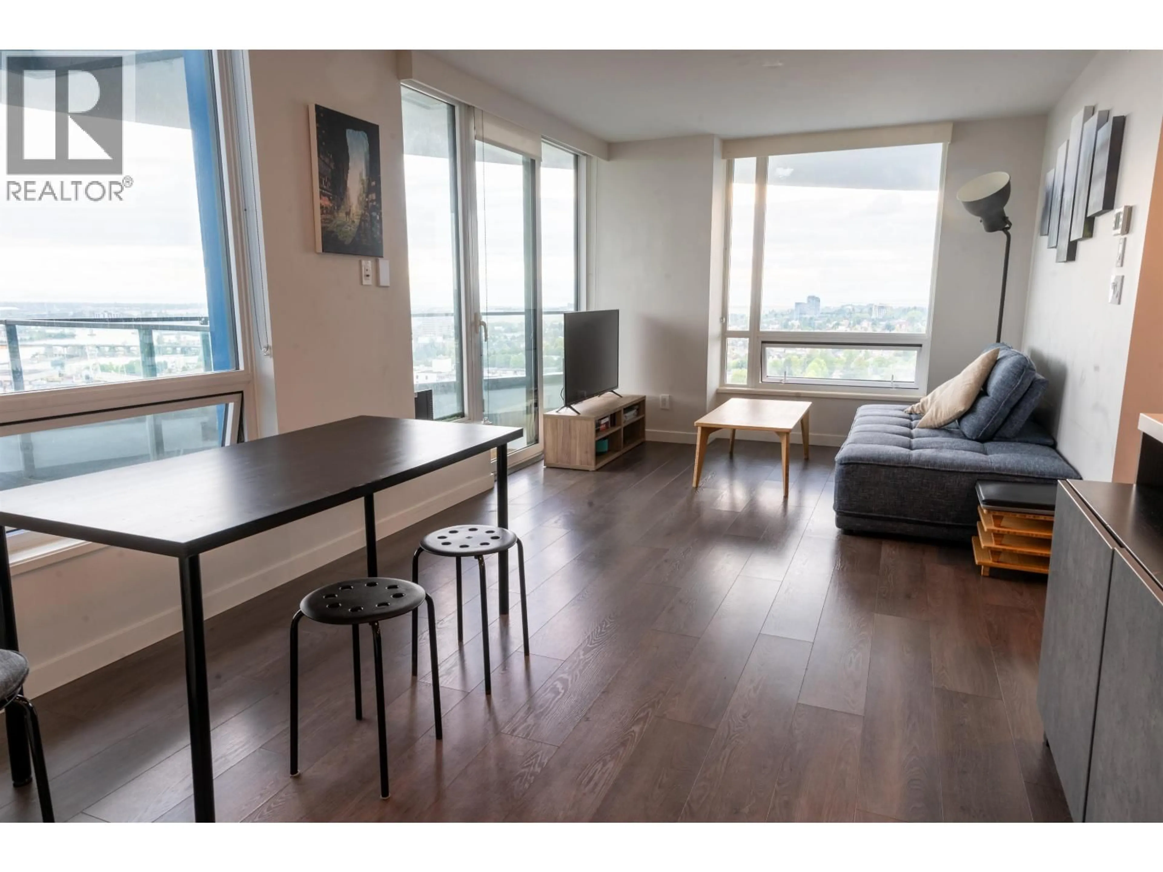 Living room with furniture, wood/laminate floor for 2701 - 8189 CAMBIE STREET, Vancouver British Columbia V6P0G6