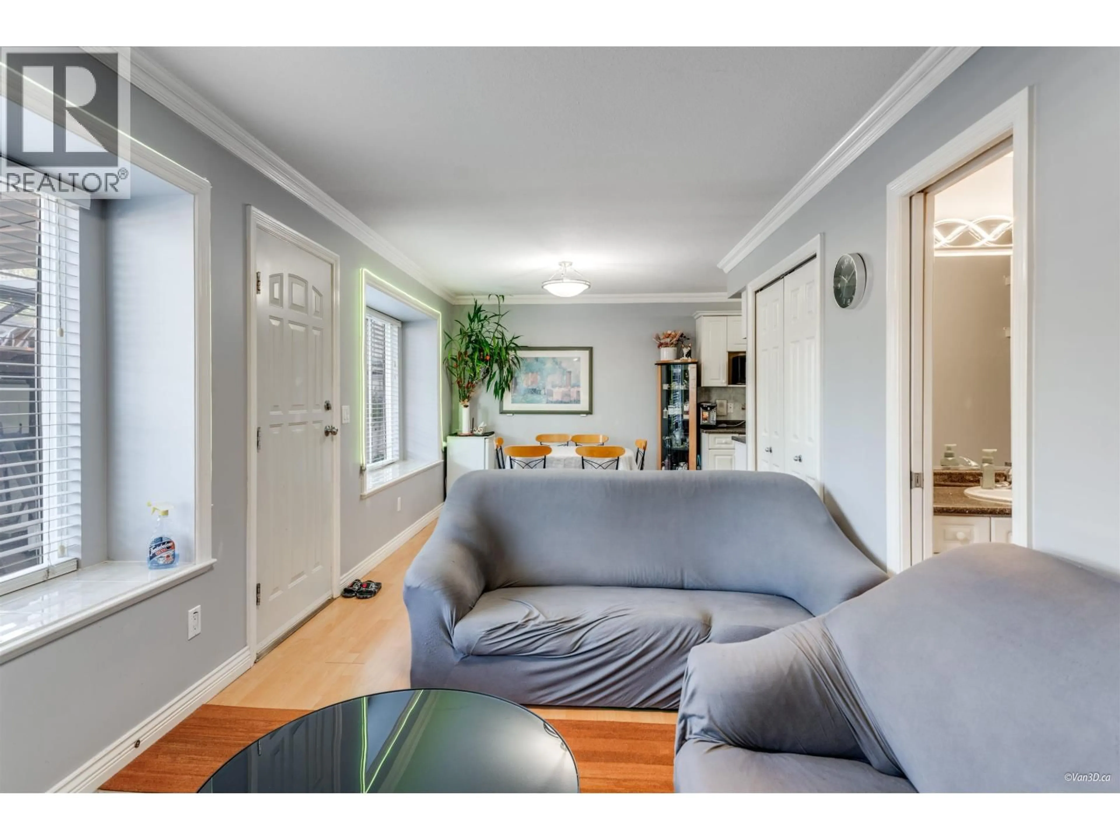 Living room with furniture, wood/laminate floor for 4663 CANADA WAY, Burnaby British Columbia V5G1K9