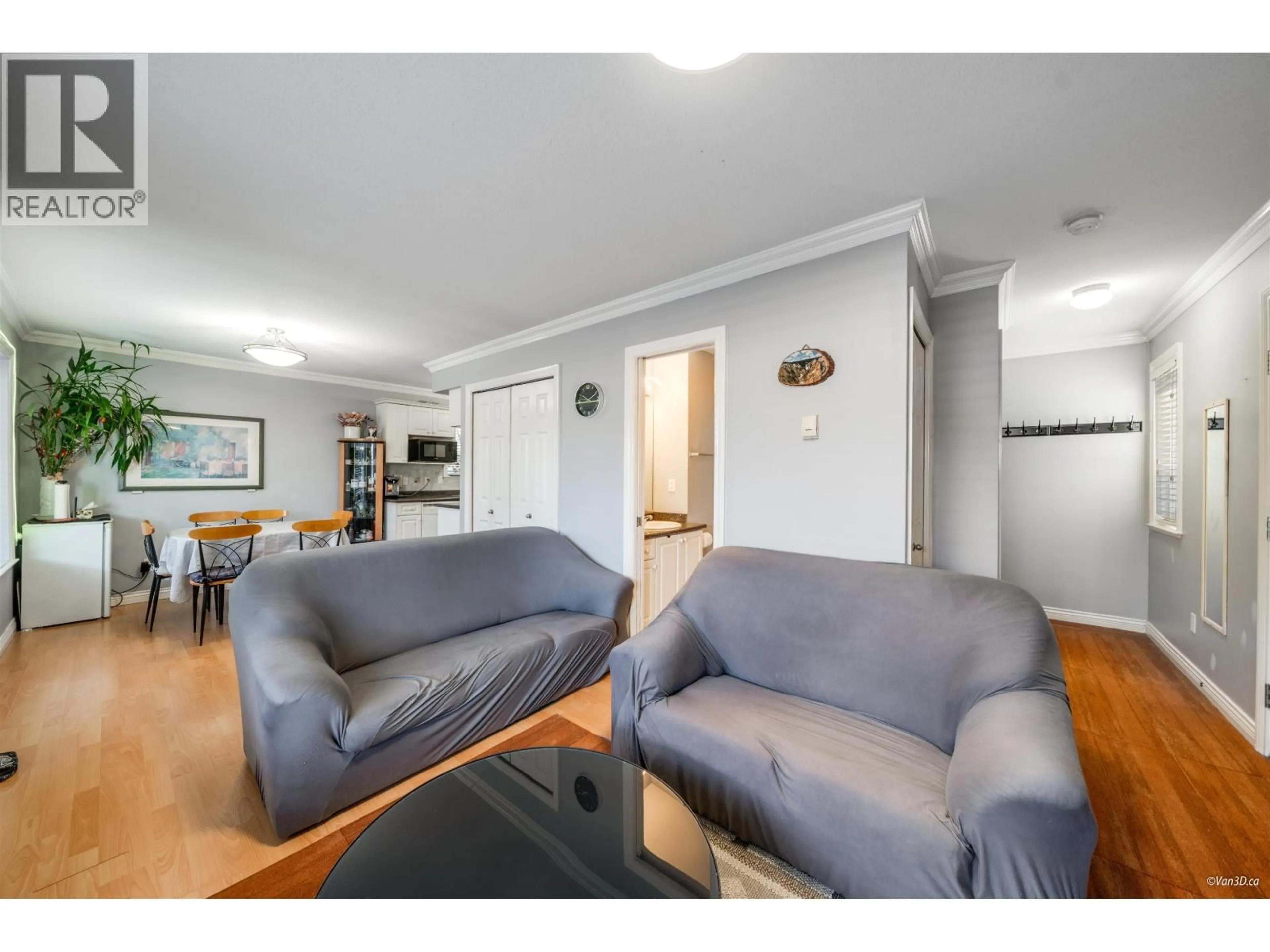 Living room with furniture, wood/laminate floor for 4663 CANADA WAY, Burnaby British Columbia V5G1K9