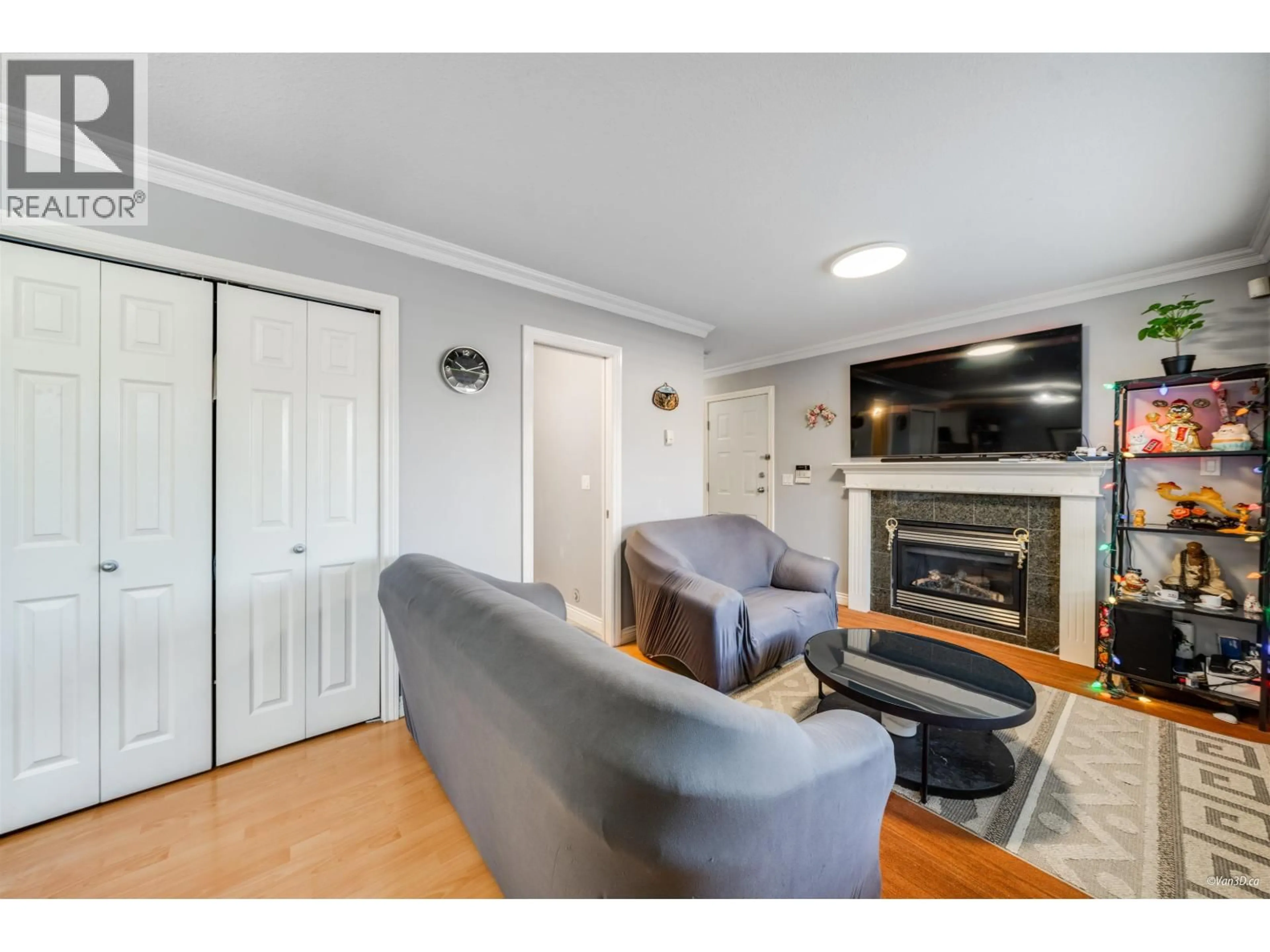 Living room with furniture, wood/laminate floor for 4663 CANADA WAY, Burnaby British Columbia V5G1K9