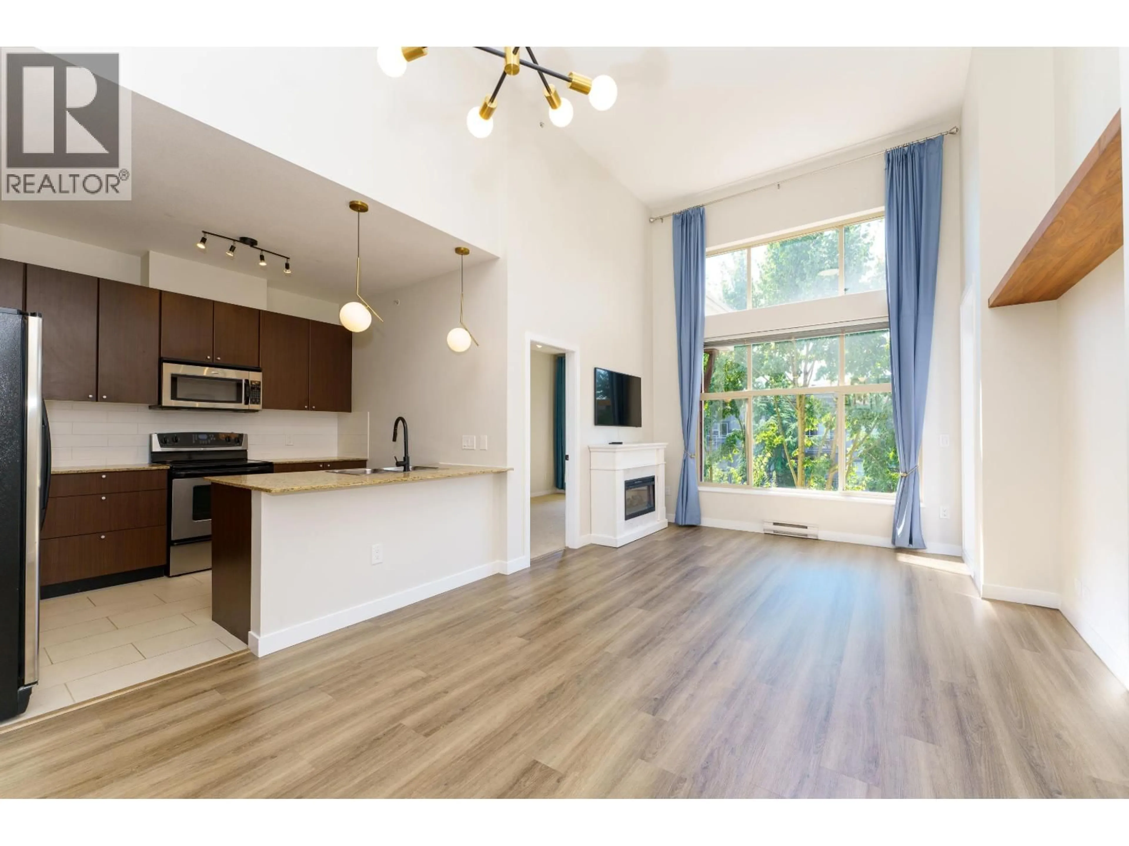 Open concept kitchen, wood/laminate floor for 420 - 2477 KELLY AVENUE, Port Coquitlam British Columbia V3C0B3