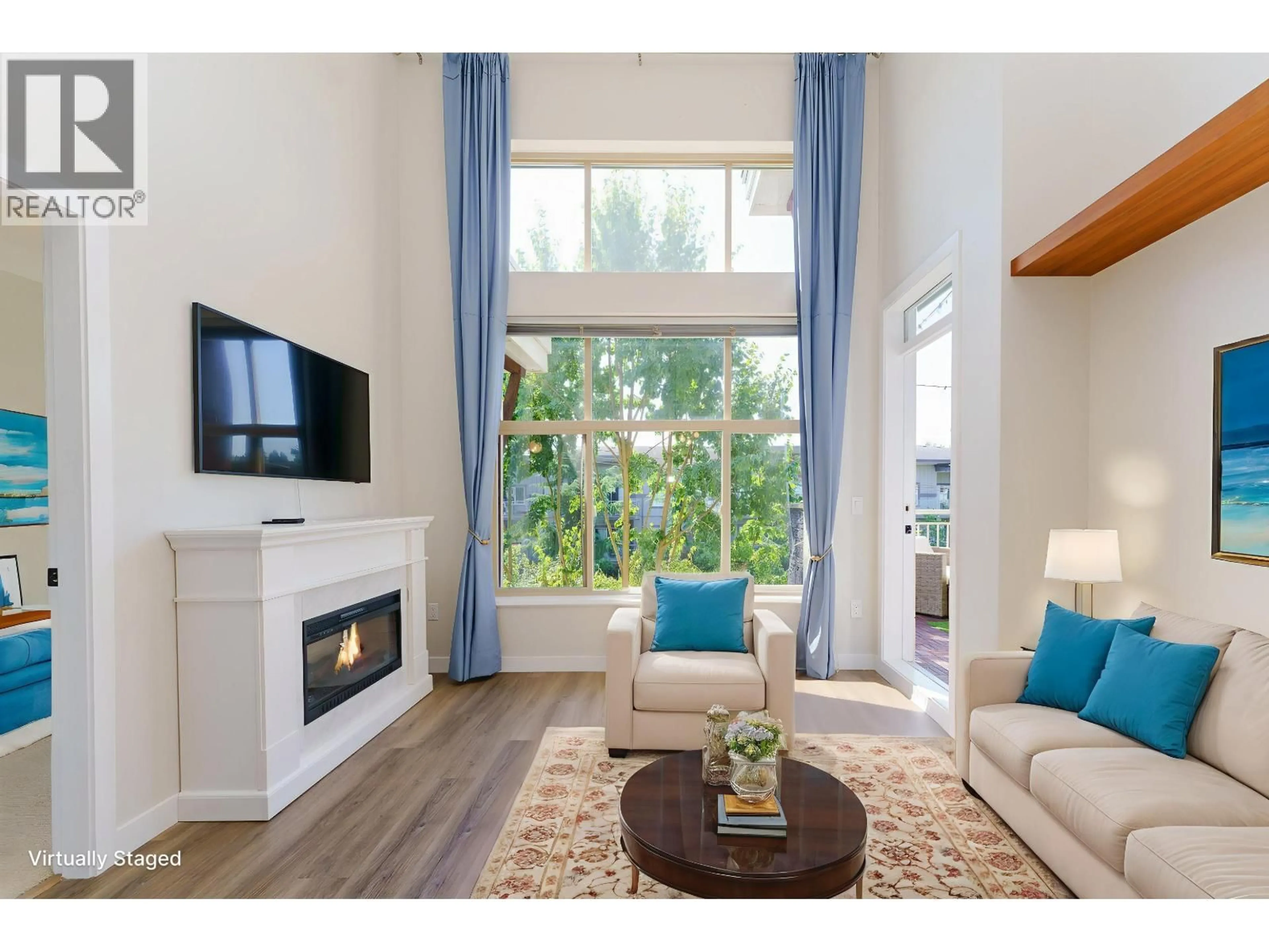 Living room with furniture, wood/laminate floor for 420 - 2477 KELLY AVENUE, Port Coquitlam British Columbia V3C0B3