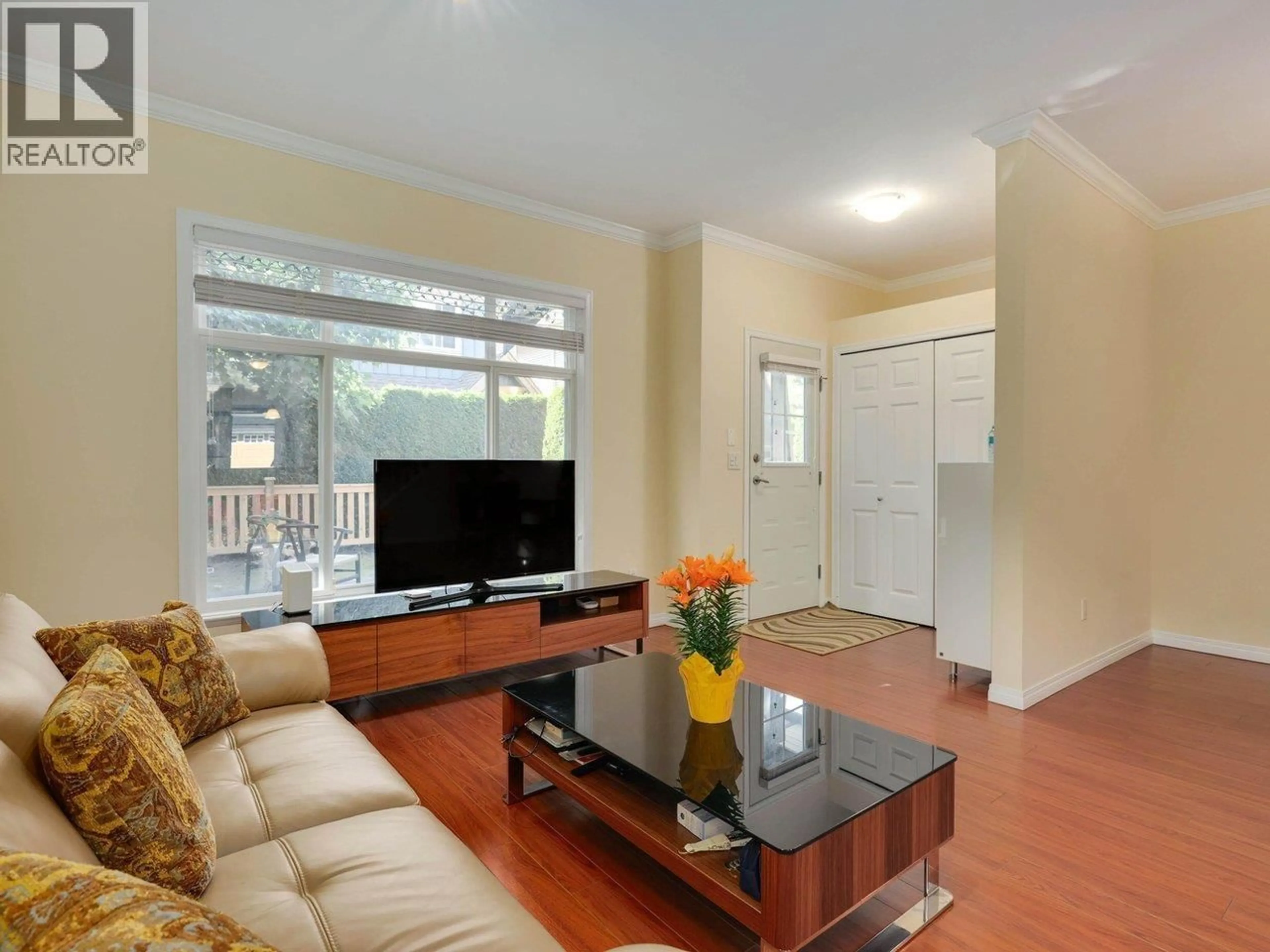 Living room with furniture, wood/laminate floor for 11 - 7788 ASH STREET, Richmond British Columbia V6Y2S1
