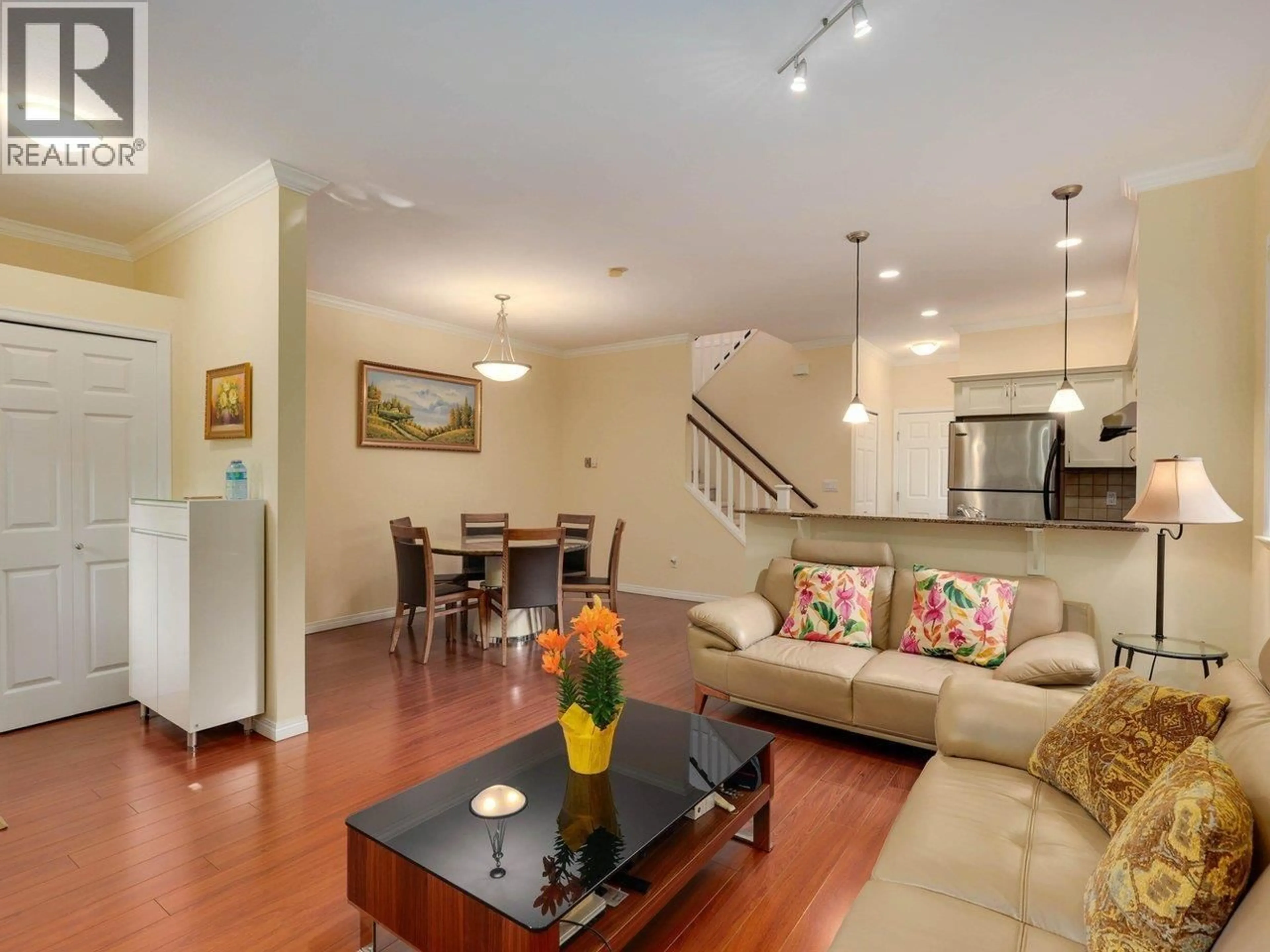 Living room with furniture, wood/laminate floor for 11 - 7788 ASH STREET, Richmond British Columbia V6Y2S1
