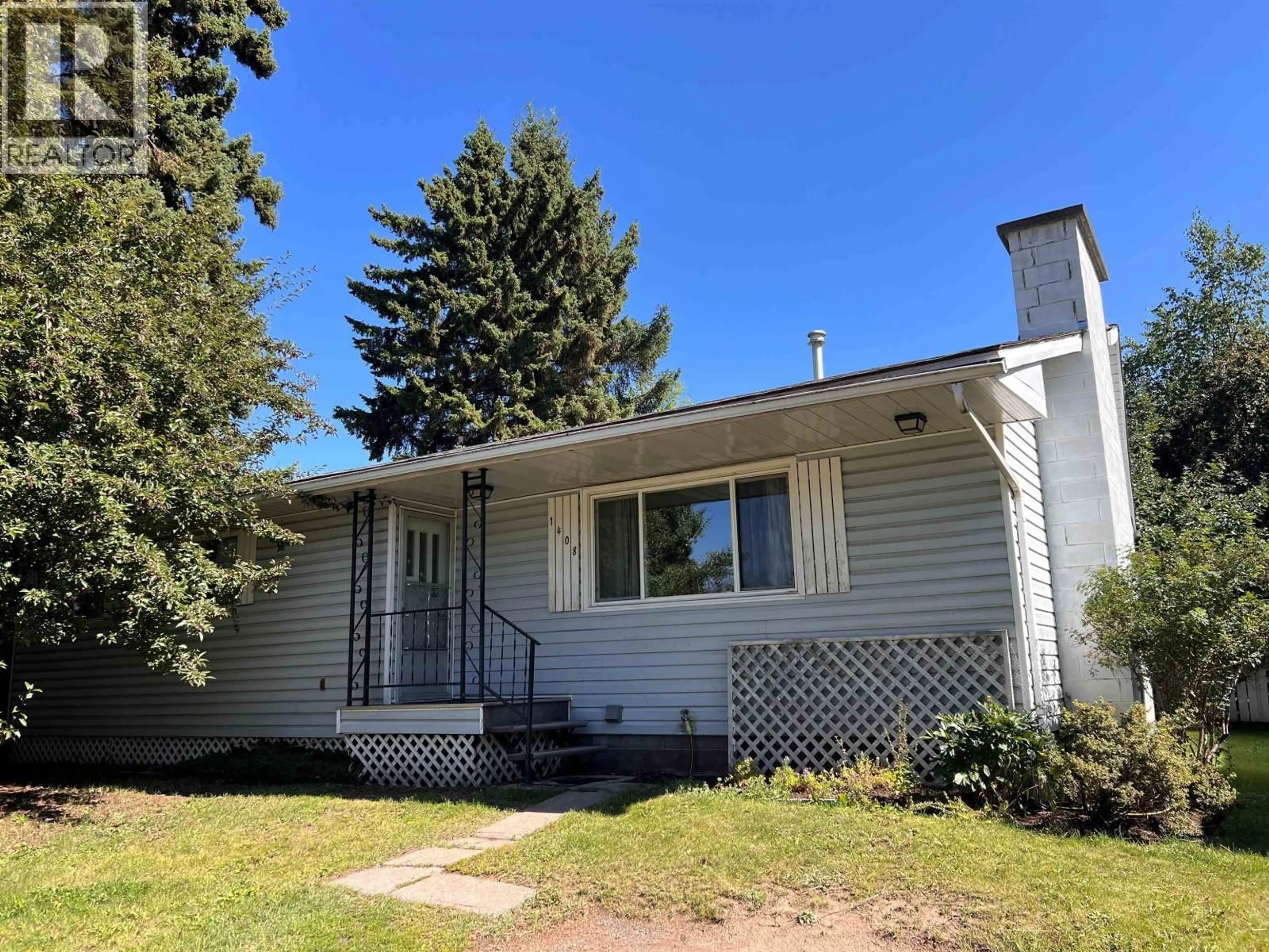 Home with vinyl exterior material, street for 1408 COLUMBIA DRIVE, Smithers British Columbia V0J2N0