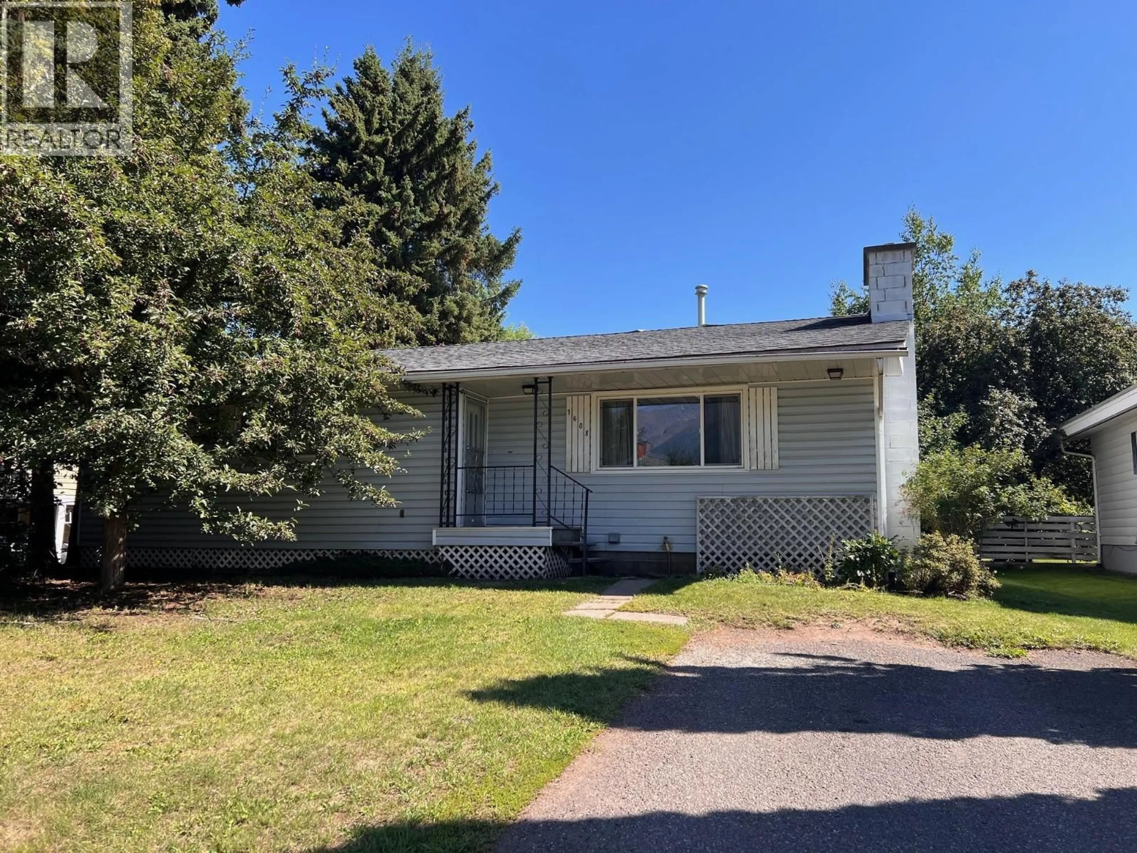 Home with vinyl exterior material, street for 1408 COLUMBIA DRIVE, Smithers British Columbia V0J2N0