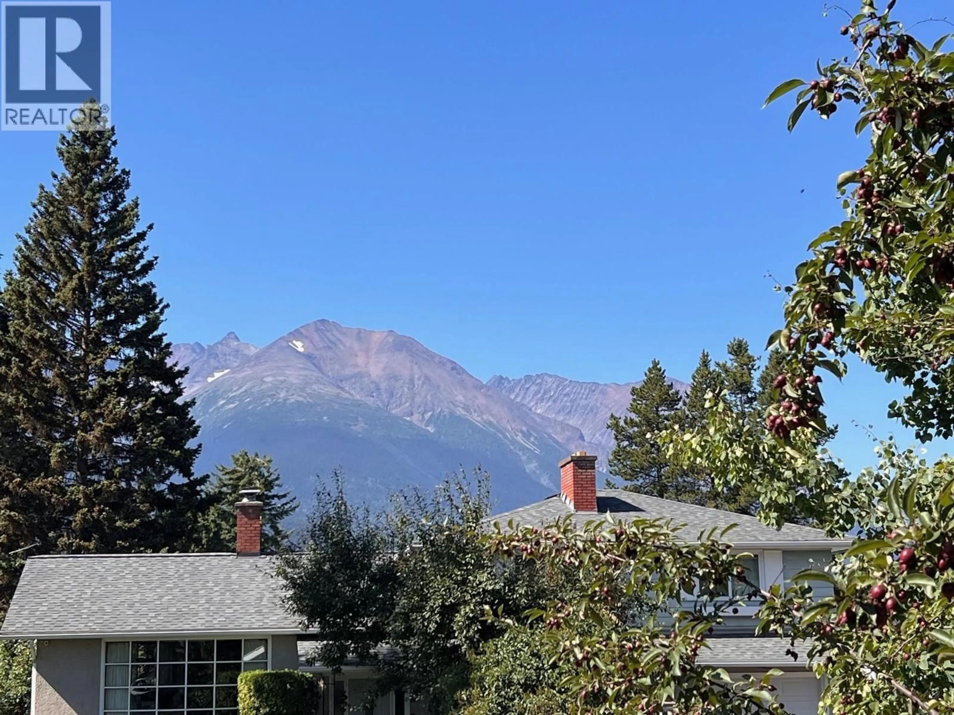 A pic from outside/outdoor area/front of a property/back of a property/a pic from drone, mountain view for 1408 COLUMBIA DRIVE, Smithers British Columbia V0J2N0