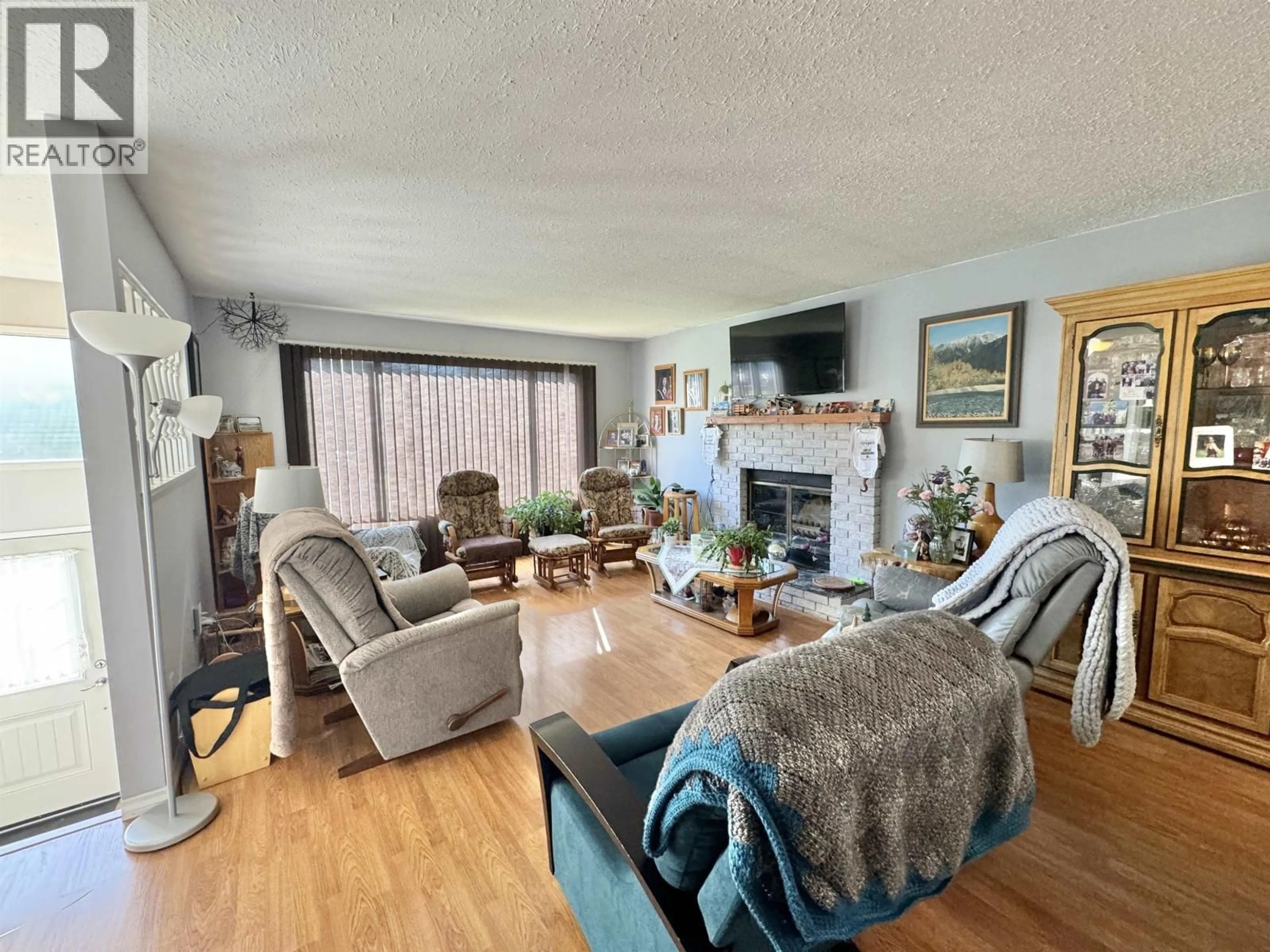 Living room with furniture, wood/laminate floor for 225 LITZENBURG CRESCENT, Williams Lake British Columbia V2G4G7