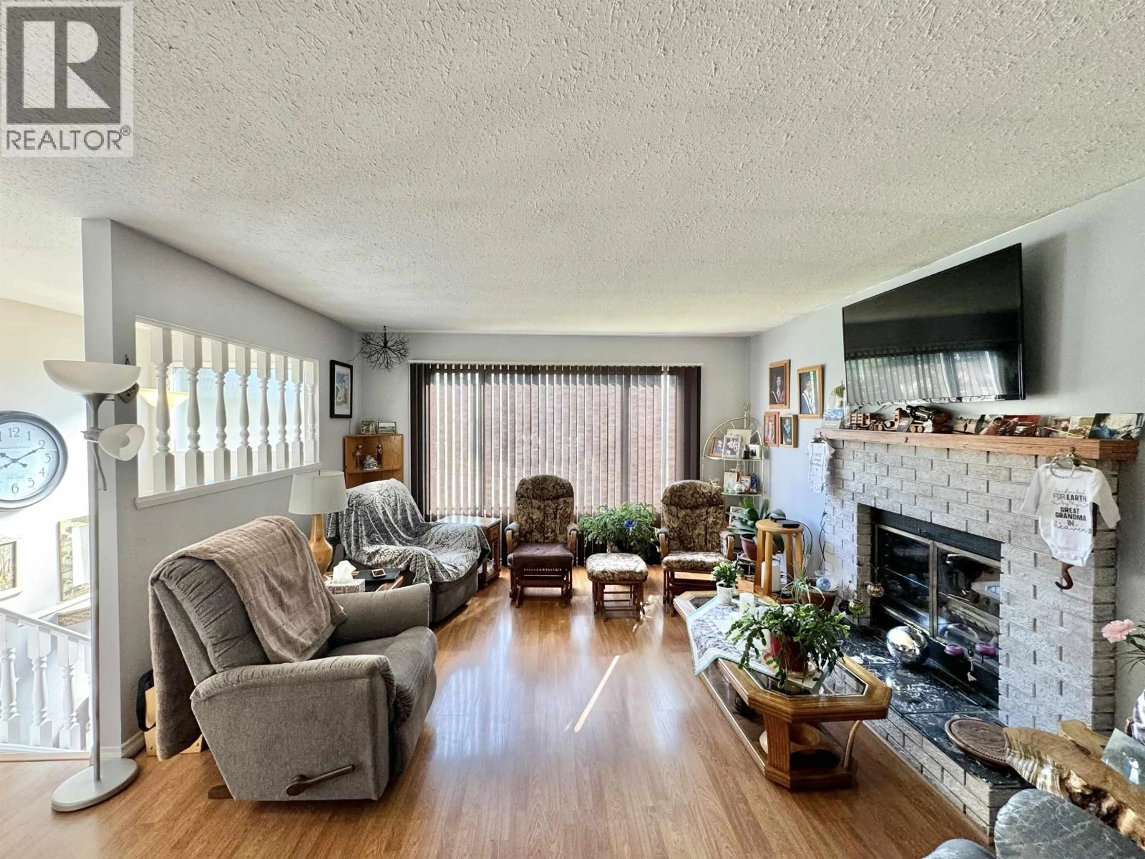 Living room with furniture, wood/laminate floor for 225 LITZENBURG CRESCENT, Williams Lake British Columbia V2G4G7
