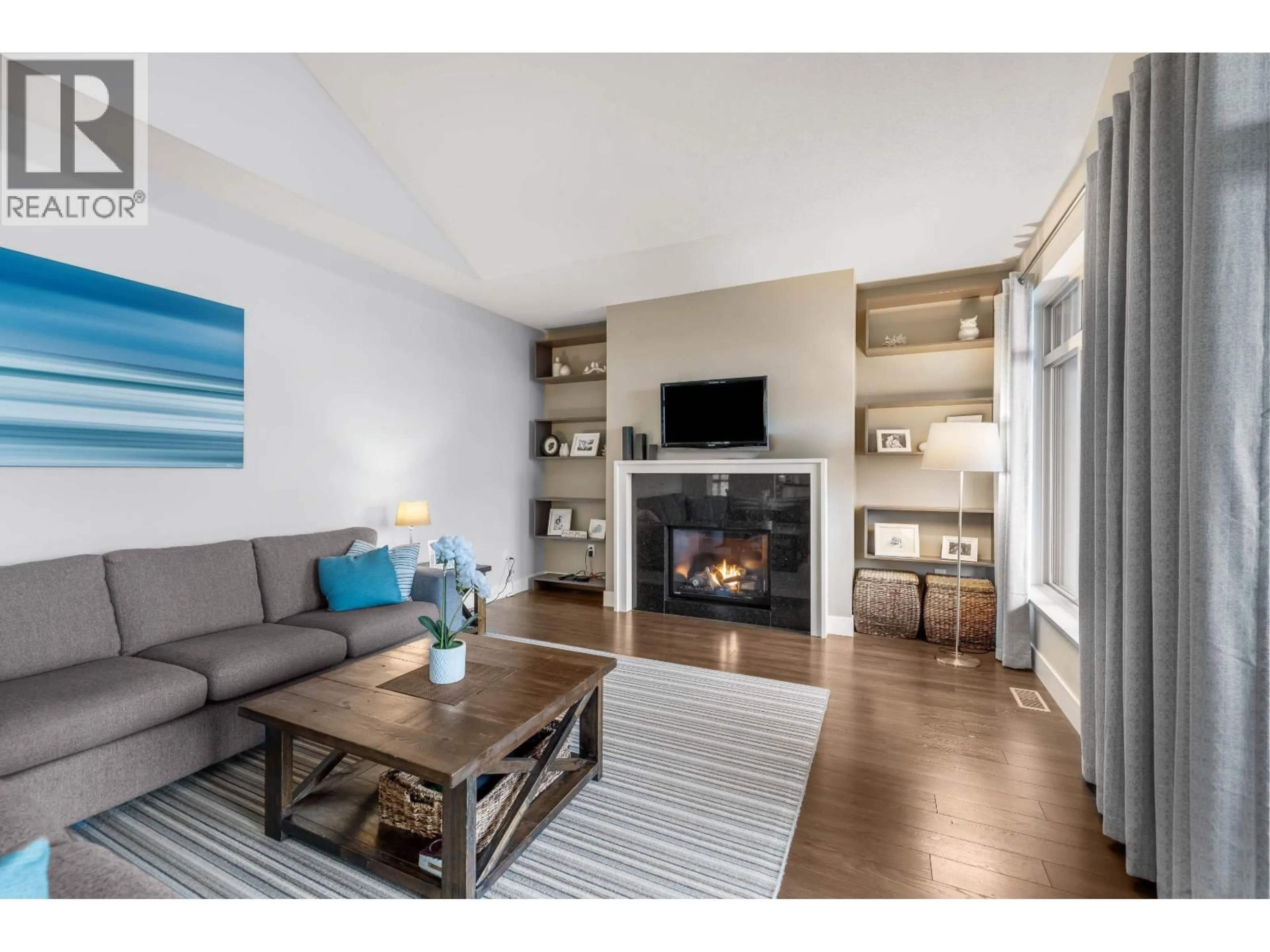 Living room with furniture, wood/laminate floor for 118 - 3467 GISLASON AVENUE, Coquitlam British Columbia V3E0H9