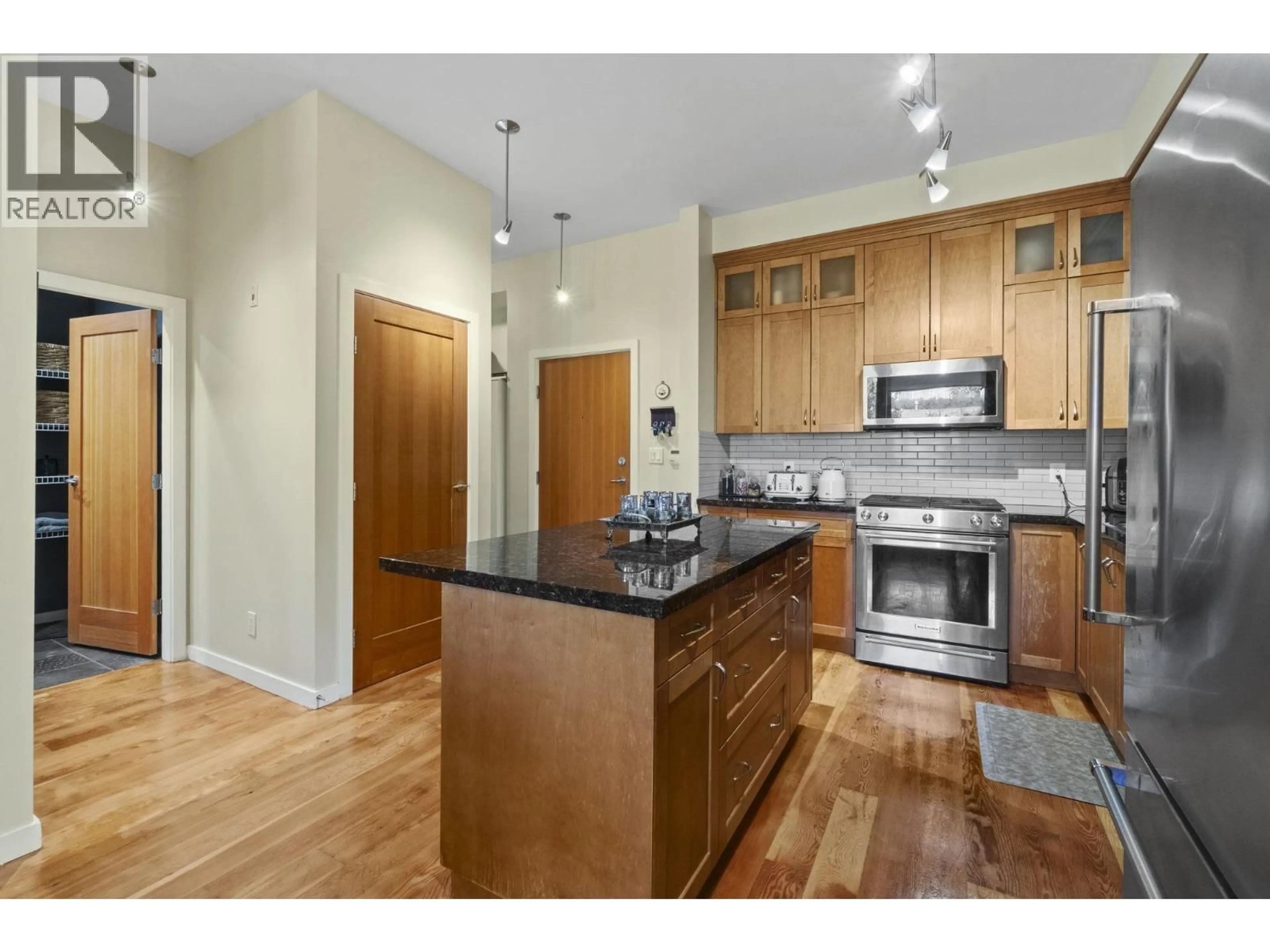 Open concept kitchen, wood/laminate floor for 302 - 250 SALTER STREET, New Westminster British Columbia V3M0B7