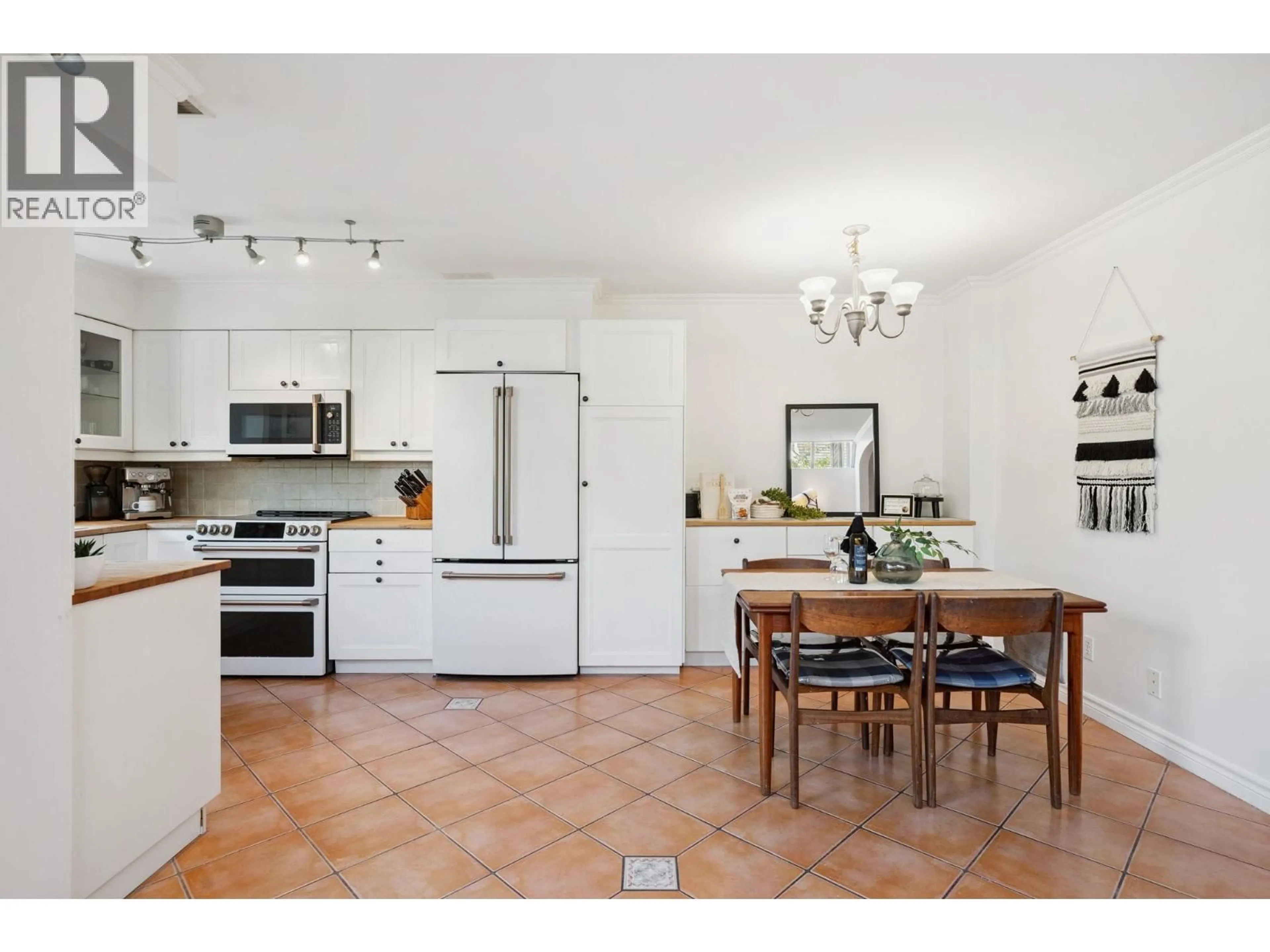 Open concept kitchen, ceramic/tile floor for 2 - 3347 DEWDNEY TRUNK ROAD, Port Moody British Columbia V3H2E4