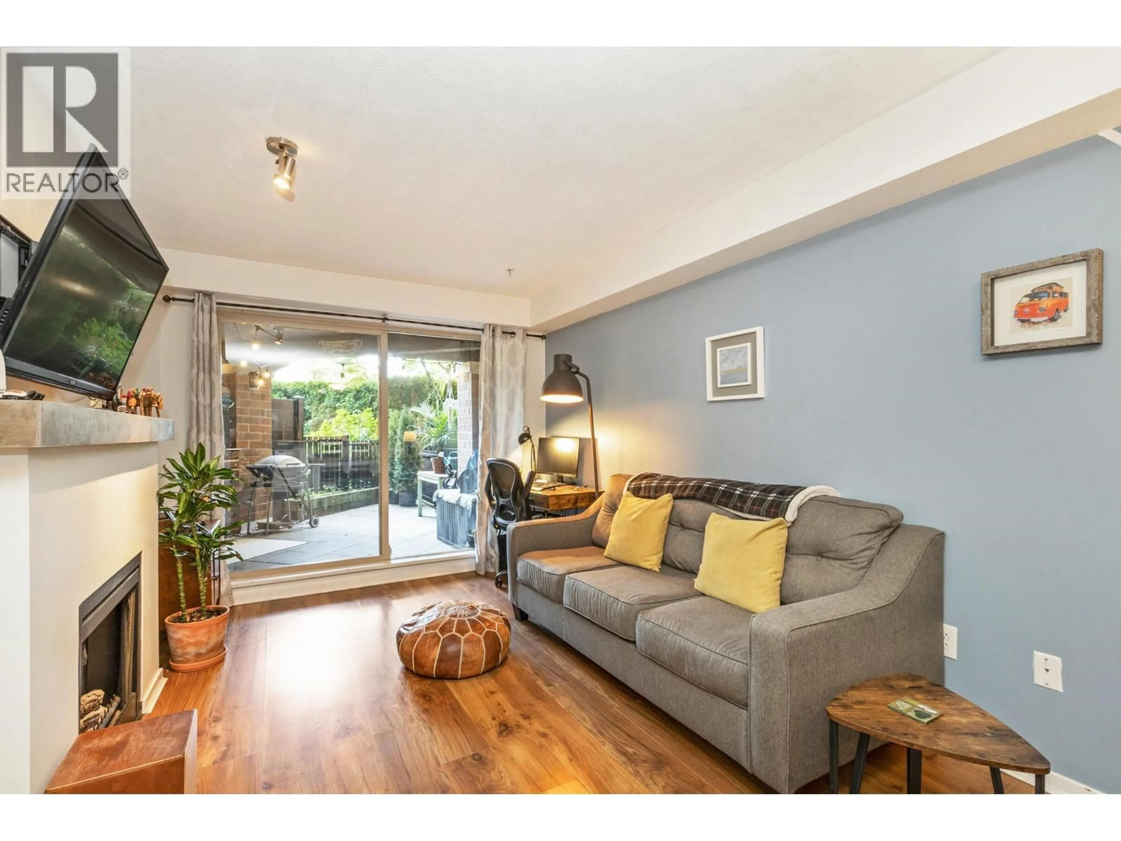 Living room with furniture, wood/laminate floor for 110 - 400 KLAHANIE DRIVE, Port Moody British Columbia V3H5K9