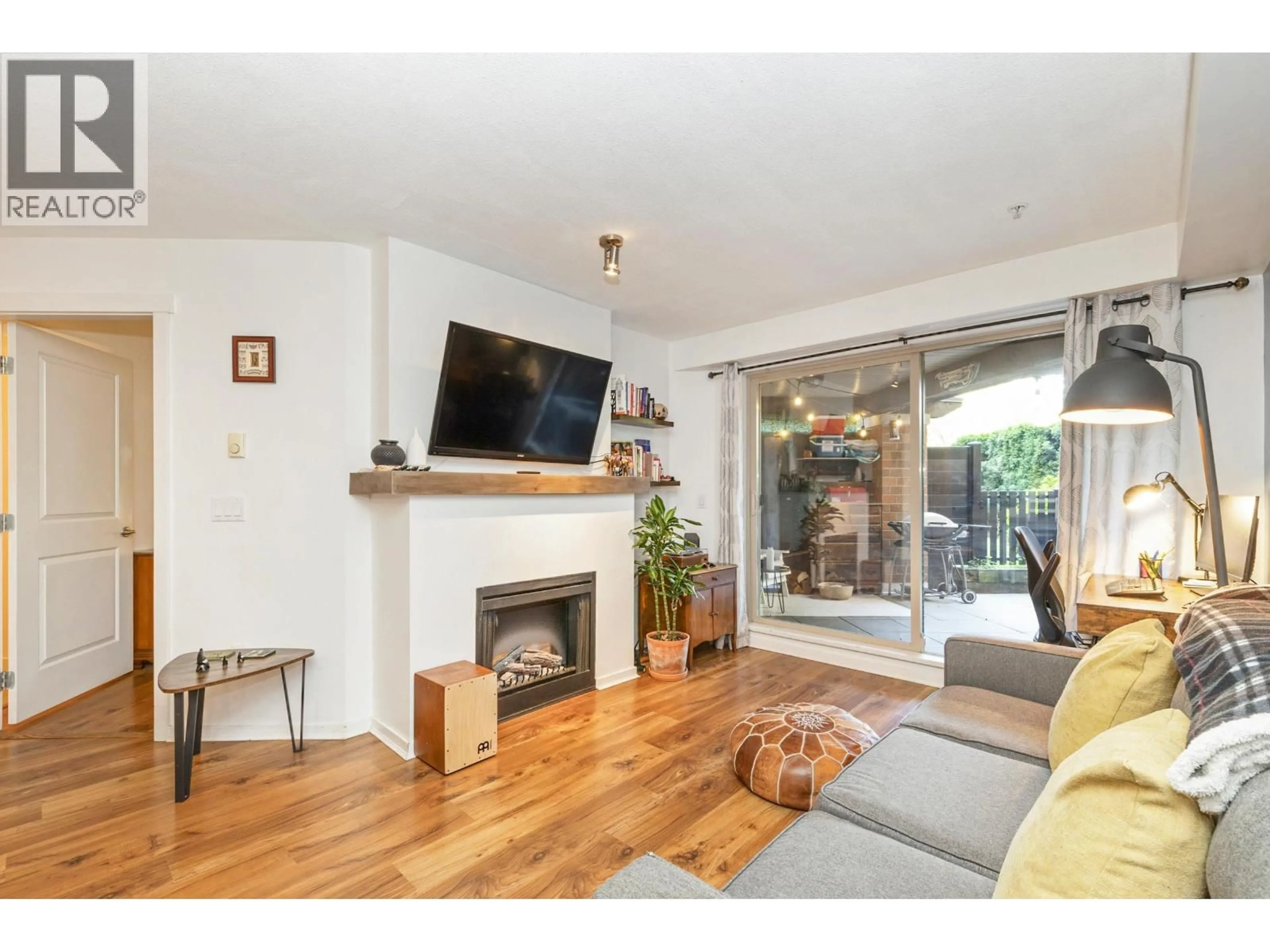 Living room with furniture, wood/laminate floor for 110 - 400 KLAHANIE DRIVE, Port Moody British Columbia V3H5K9