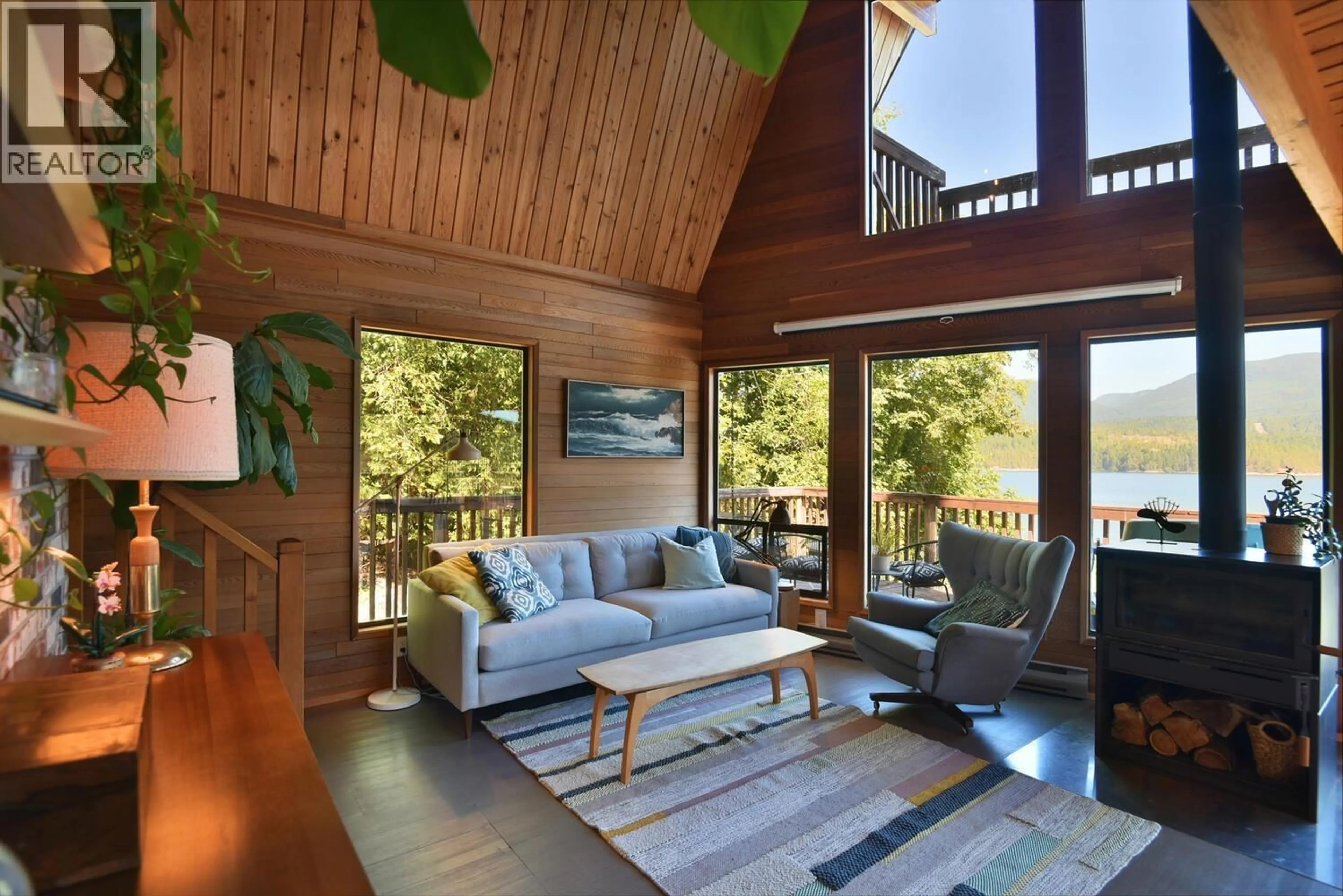 Living room with furniture, wood/laminate floor for 6318 GALE AVENUE, Sechelt British Columbia V7Z0P8