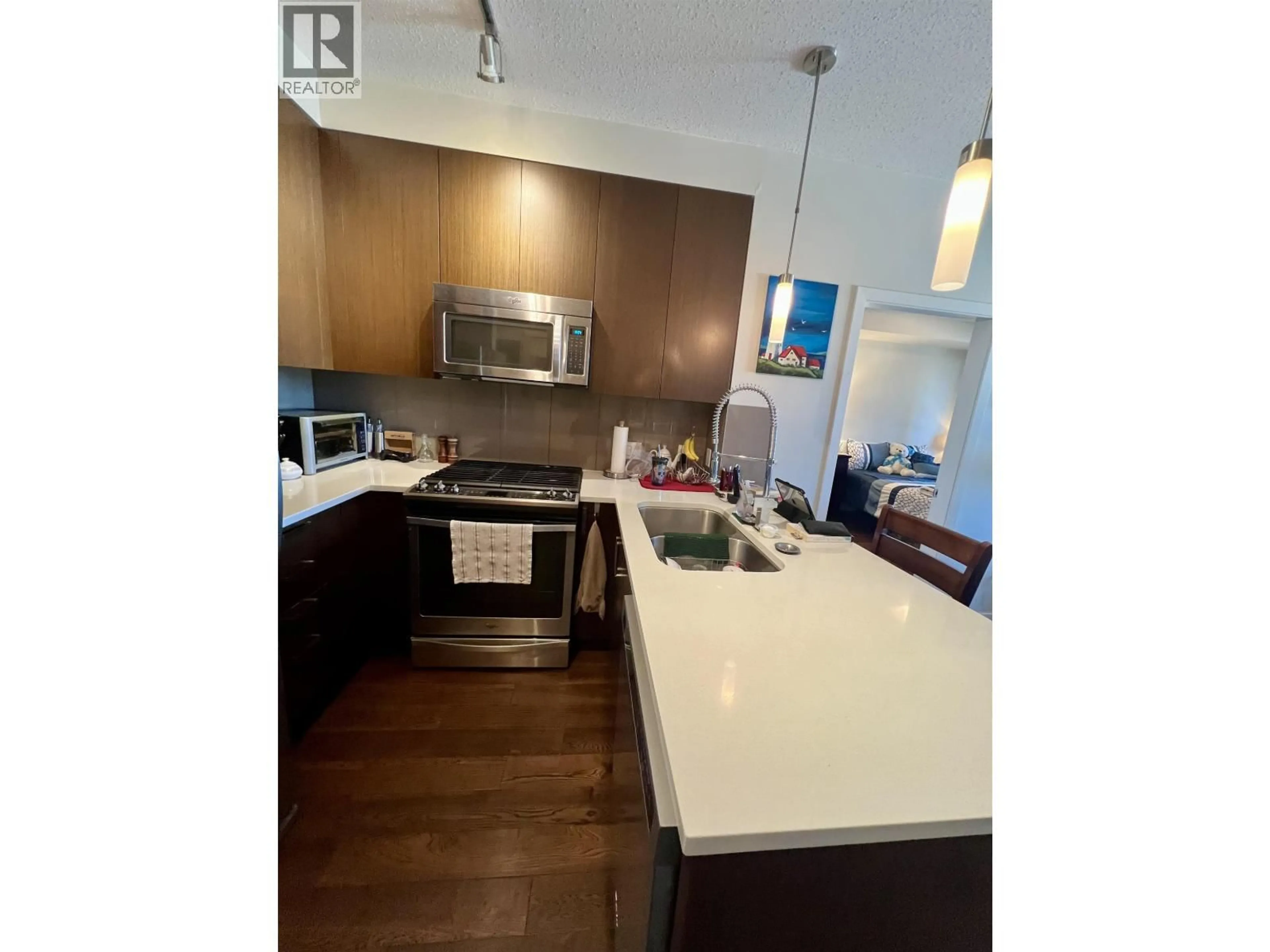 Open concept kitchen, wood/laminate floor for 302 - 12409 HARRIS ROAD, Pitt Meadows British Columbia V3Y0E7