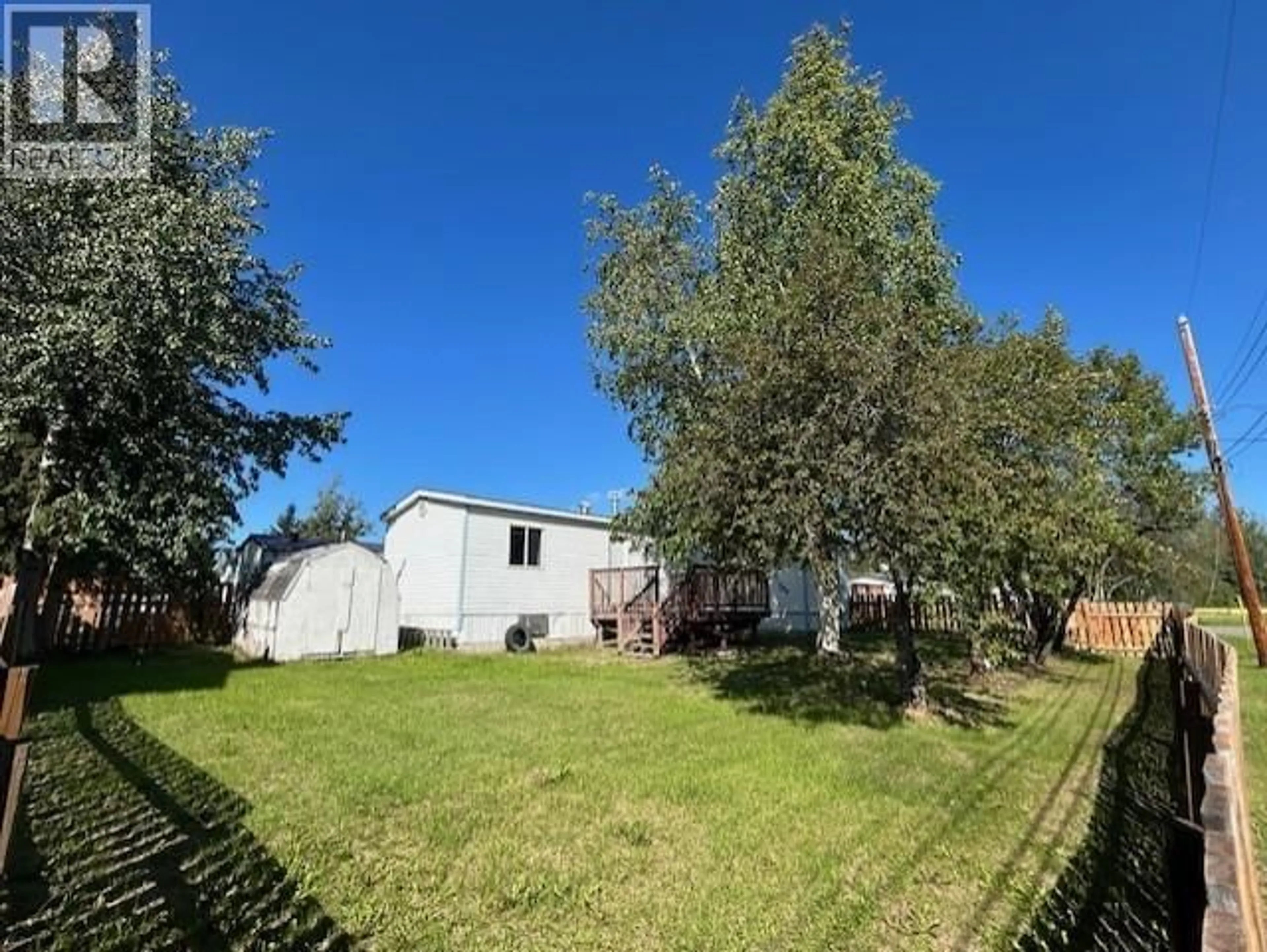 A pic from outside/outdoor area/front of a property/back of a property/a pic from drone, street for 3903 POPLAR AVENUE, Fort Nelson British Columbia V0C1R0