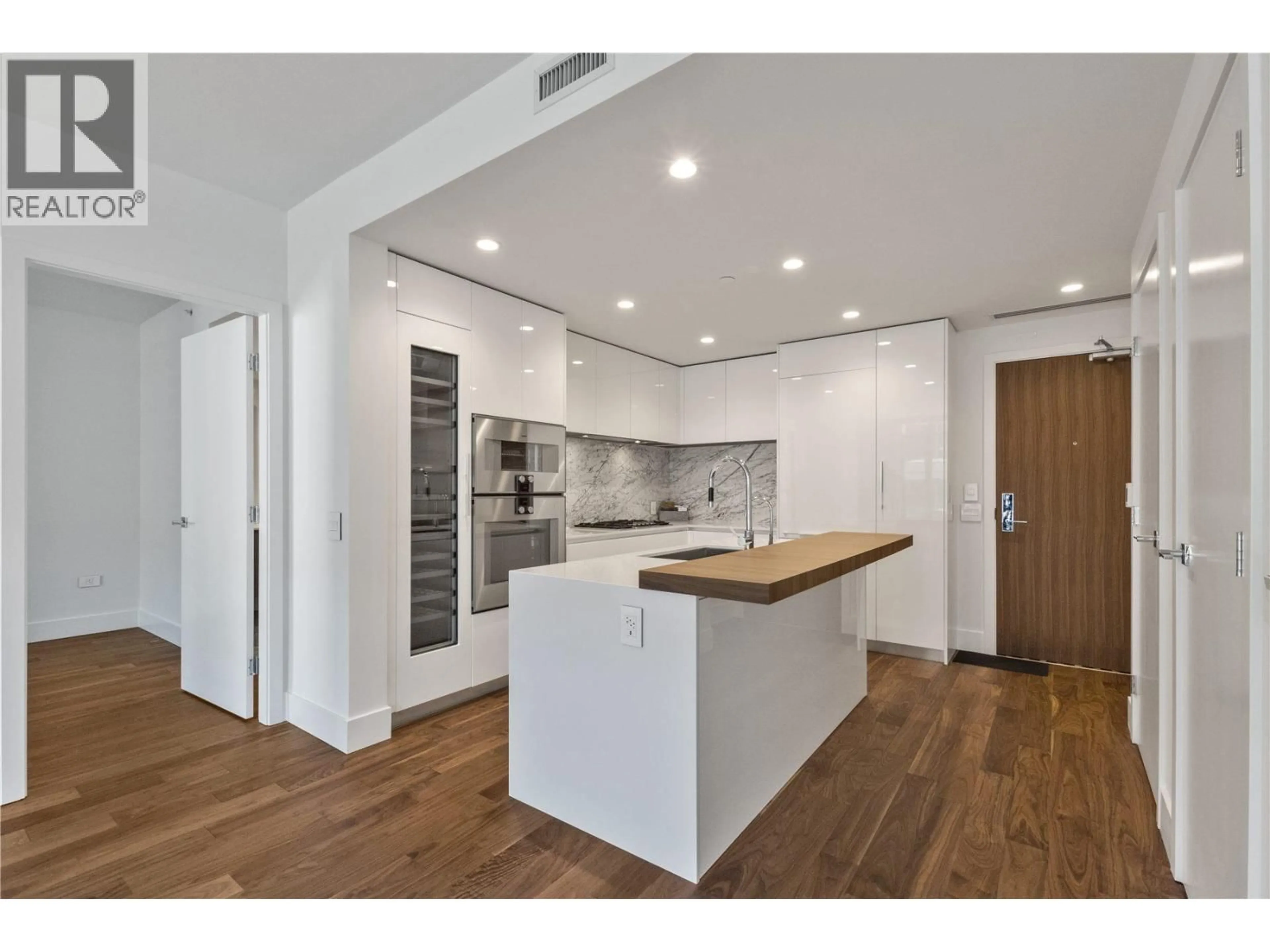 Open concept kitchen, wood/laminate floor for 301 - 389 59TH AVENUE, Vancouver British Columbia V5X0J4