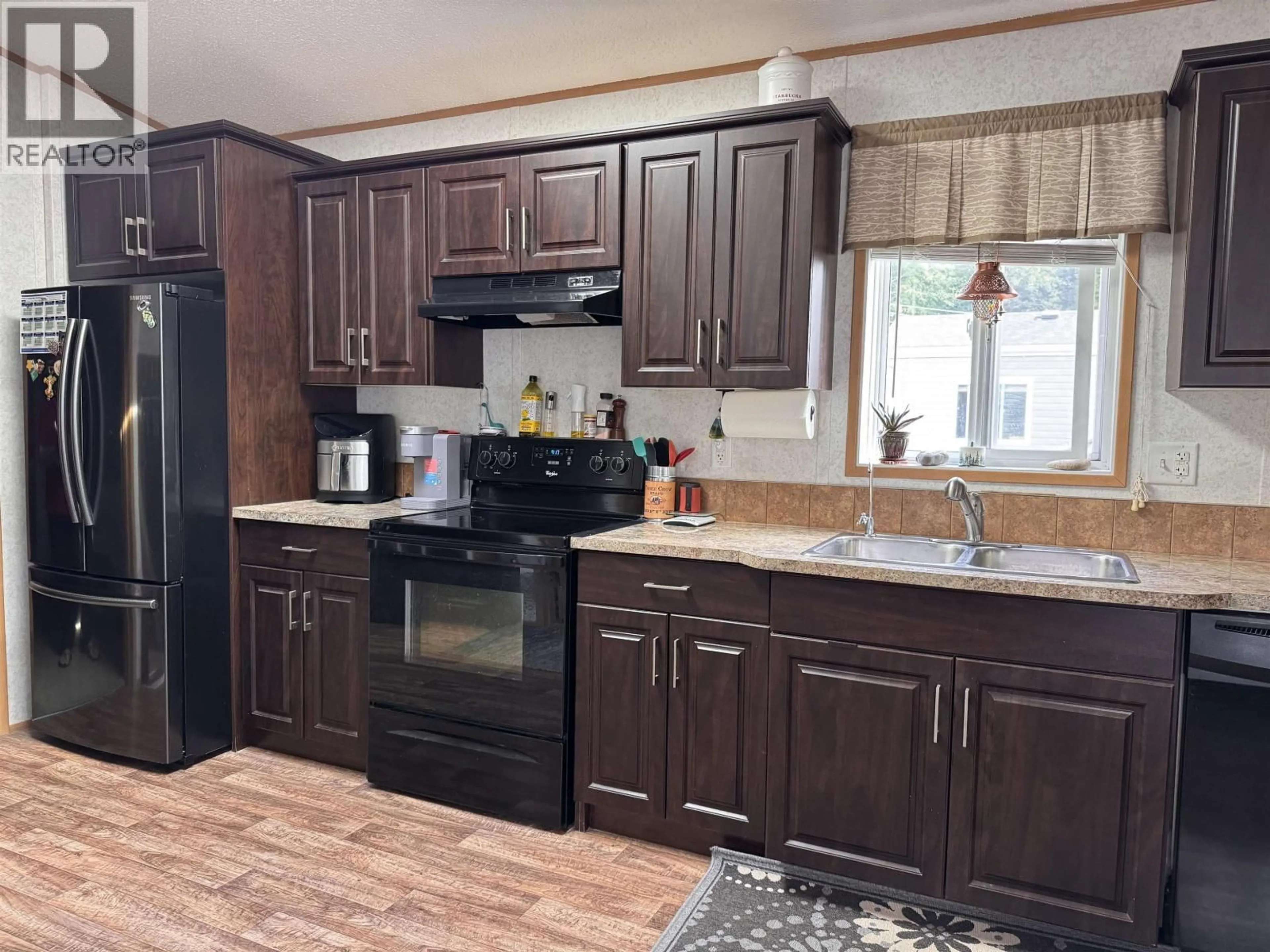 Open concept kitchen, wood/laminate floor for 5204 ACKROYD STREET, Terrace British Columbia V8G1E6