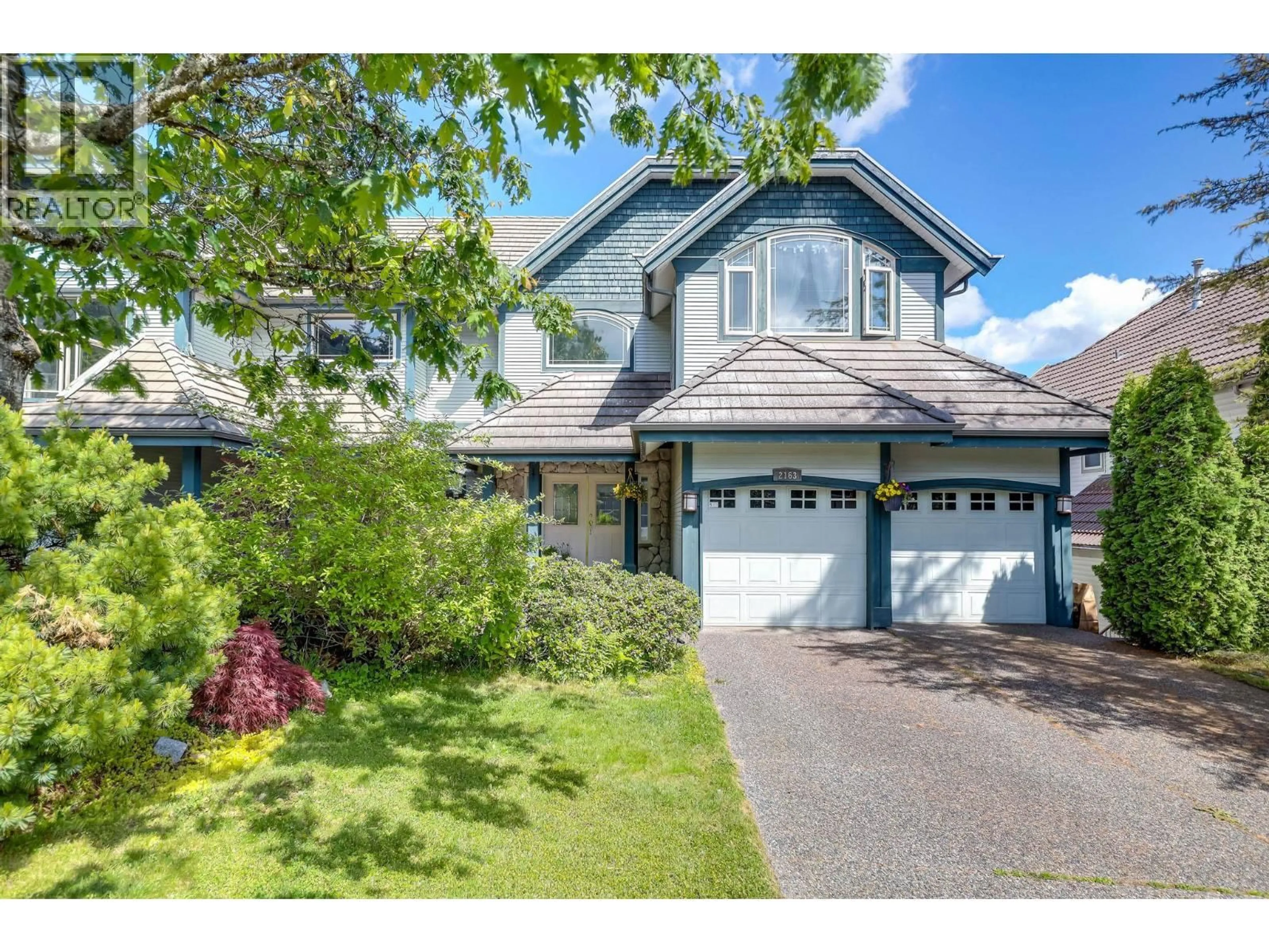 Home with vinyl exterior material, street for 2163 PARKWAY BOULEVARD, Coquitlam British Columbia V3E3K5