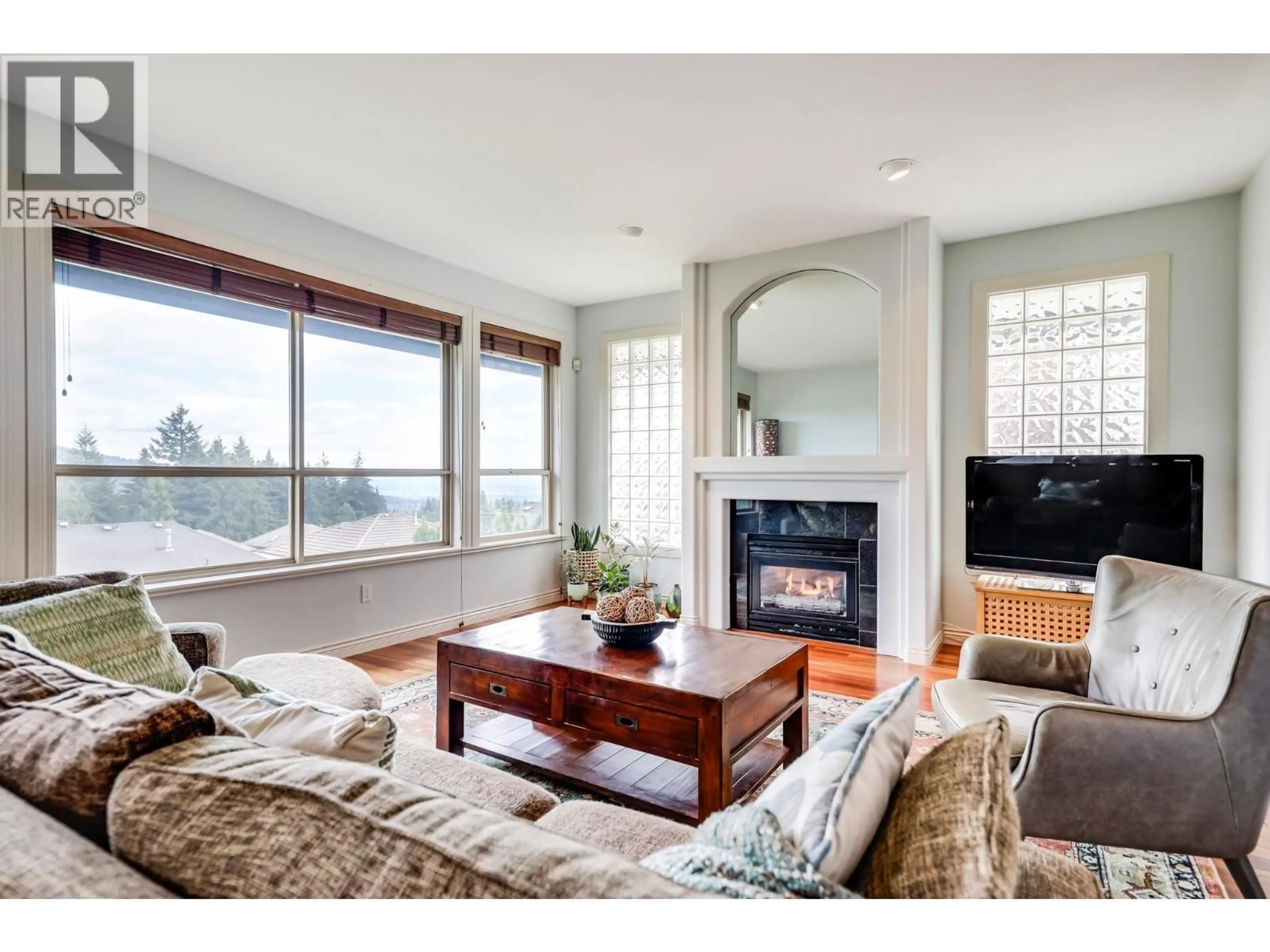 Living room with furniture, wood/laminate floor for 2163 PARKWAY BOULEVARD, Coquitlam British Columbia V3E3K5