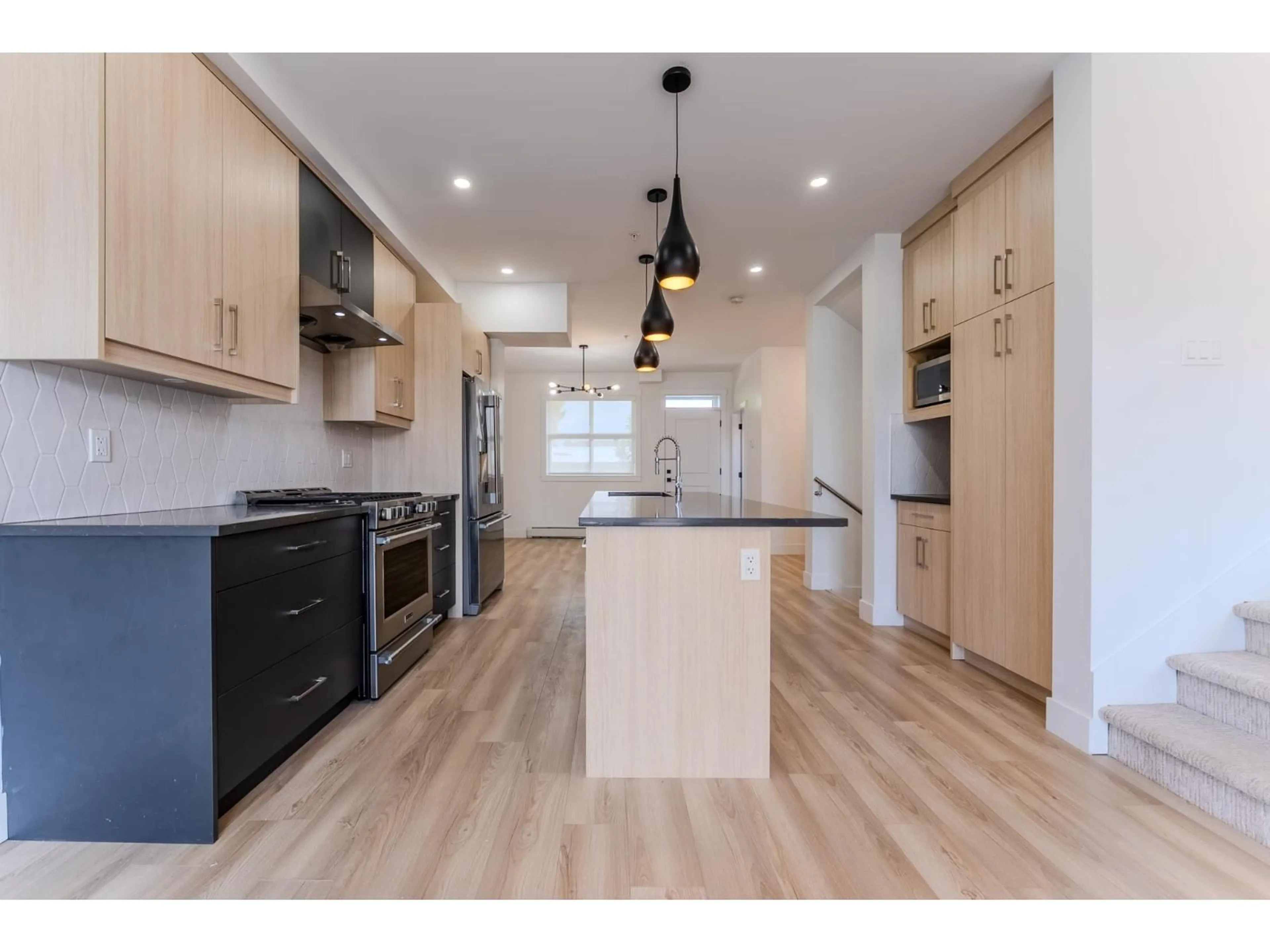 Open concept kitchen, wood/laminate floor for 2 - 46376 YALE ROAD, Chilliwack British Columbia V2P2R2