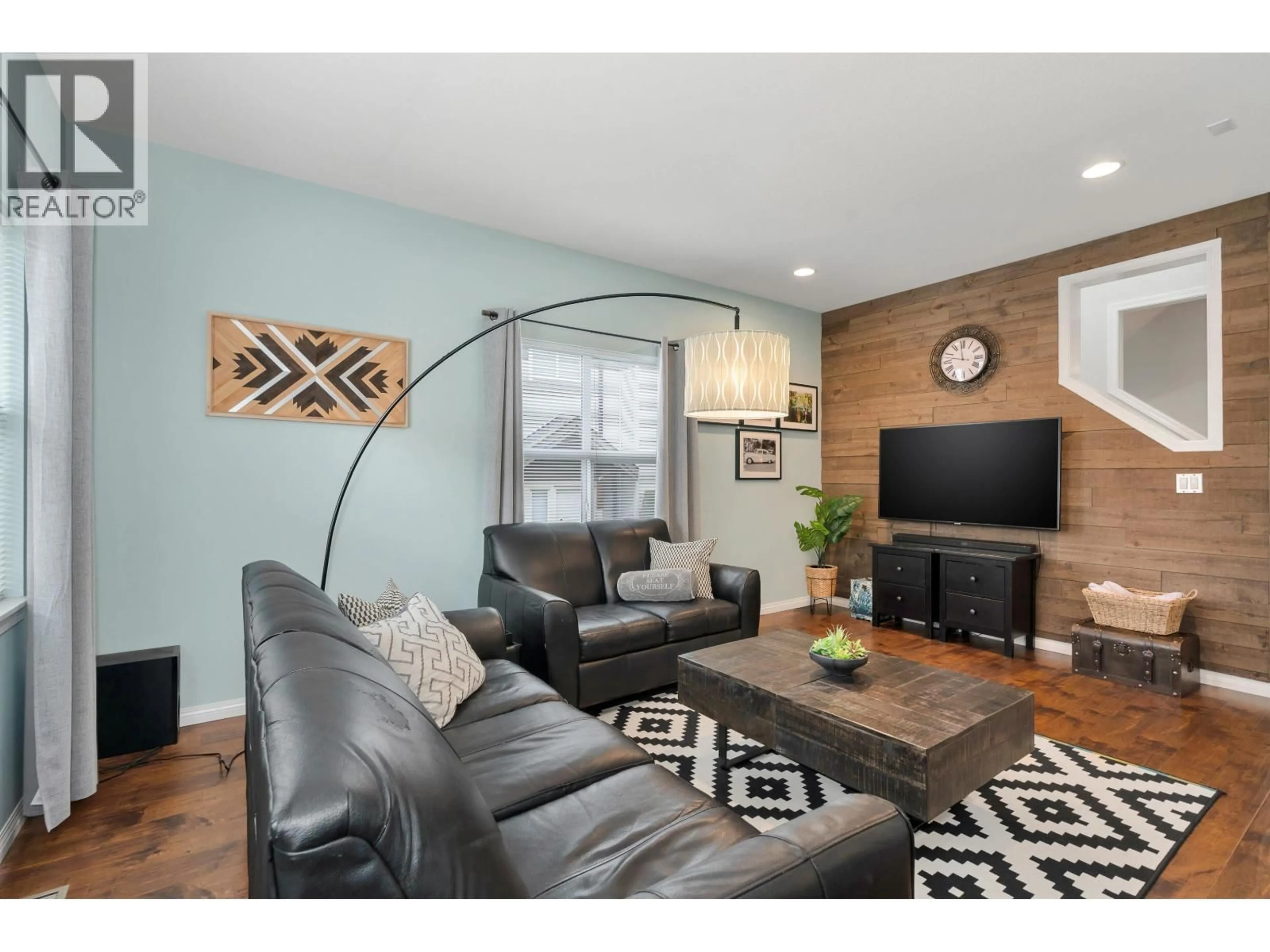 Living room with furniture, wood/laminate floor for 12 - 1055 RIVERWOOD GATE, Port Coquitlam British Columbia V3B8C3