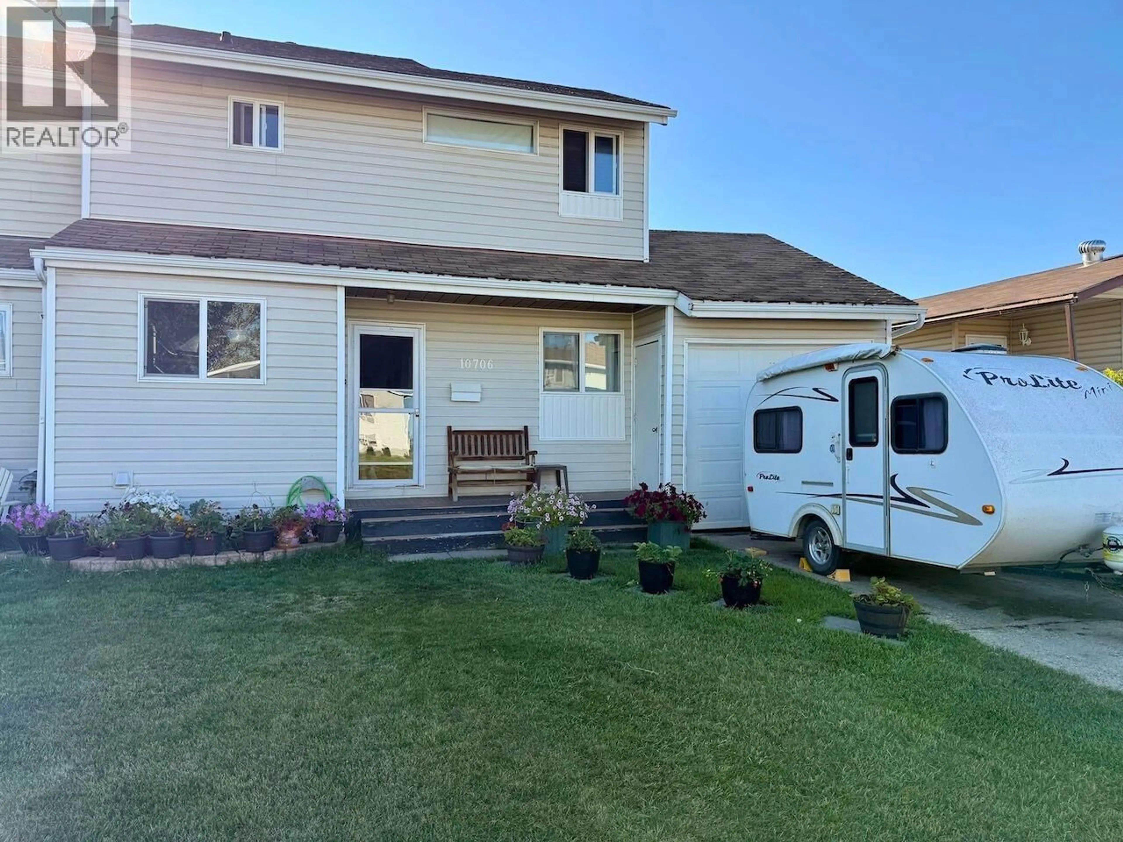 Home with vinyl exterior material, street for 10706 88A STREET, Fort St. John British Columbia V1J5X9