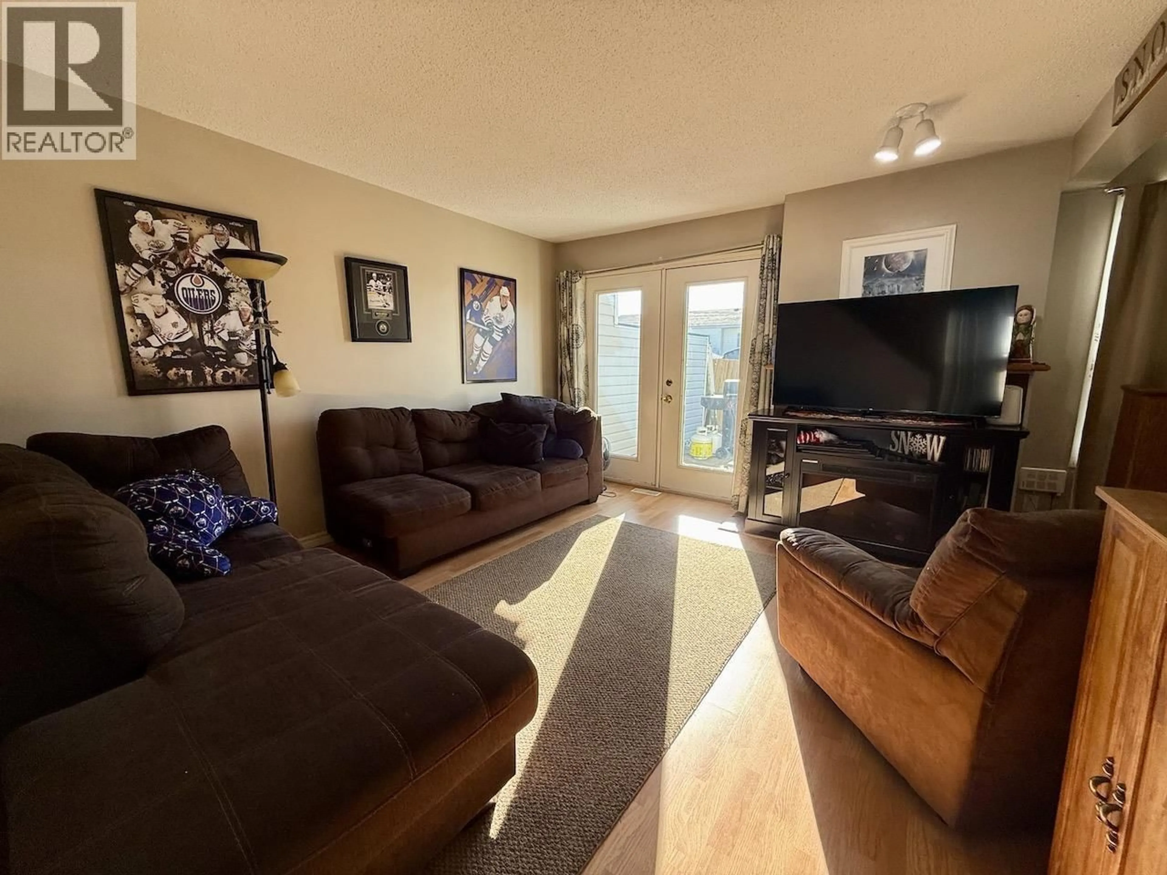 Living room with furniture, unknown for 10706 88A STREET, Fort St. John British Columbia V1J5X9
