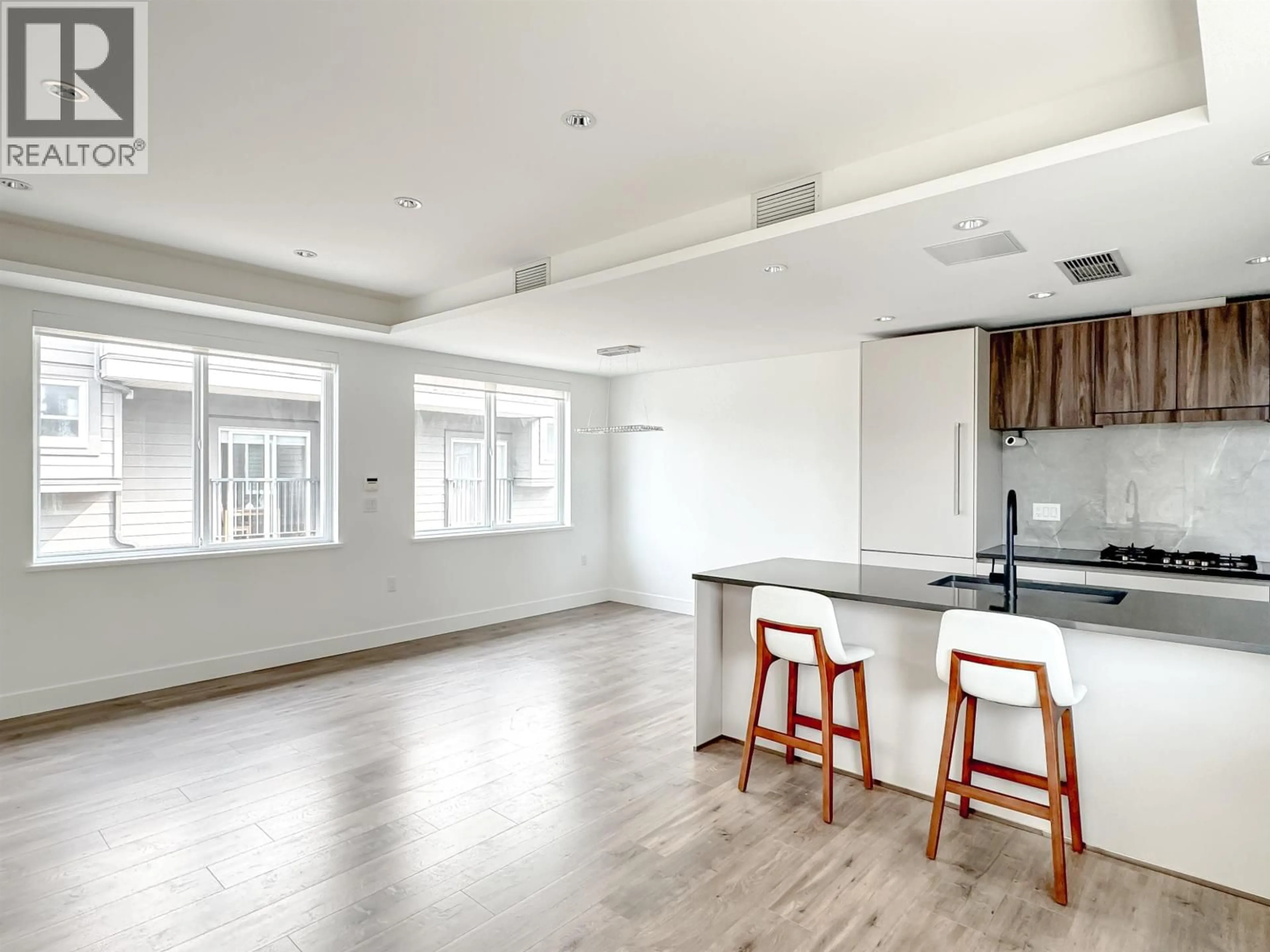 Open concept kitchen, wood/laminate floor for 8 - 7000 WILLIAMS ROAD, Richmond British Columbia V7A1E6