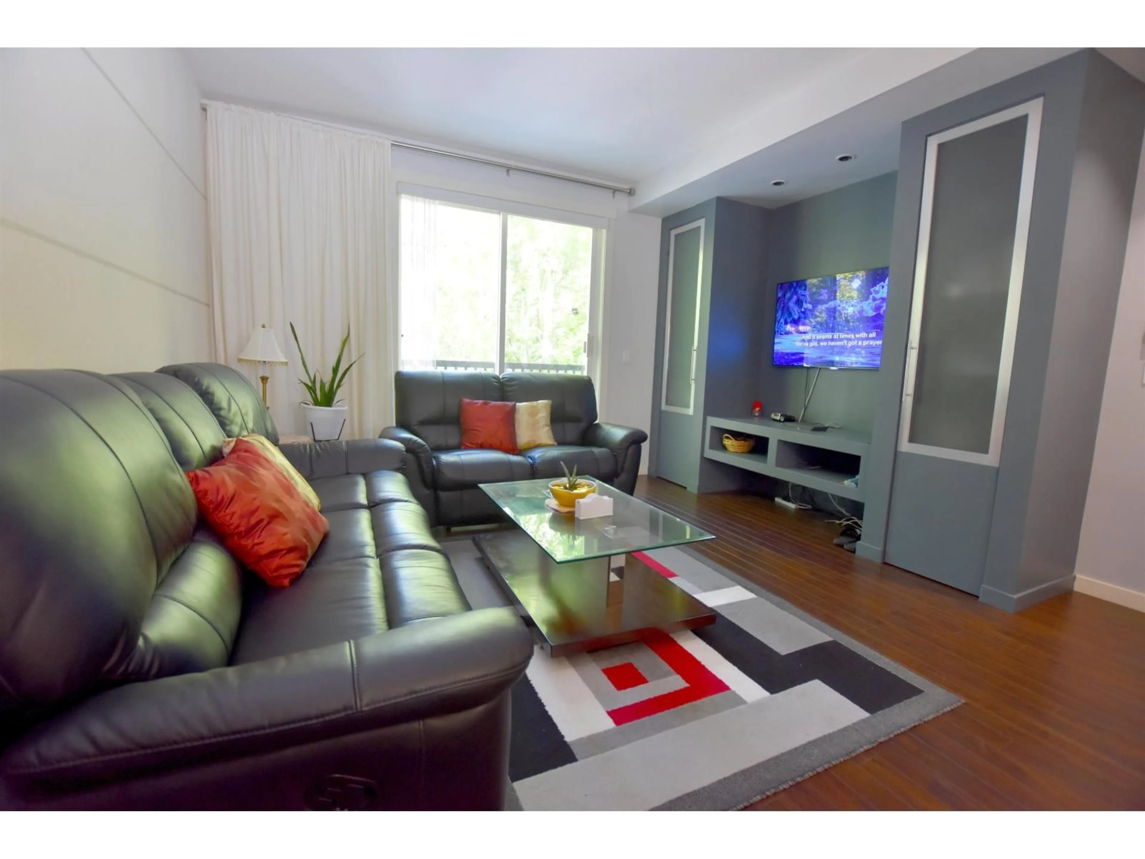 Living room with furniture, wood/laminate floor for 34 - 18983 72A, Surrey British Columbia V4N1A5