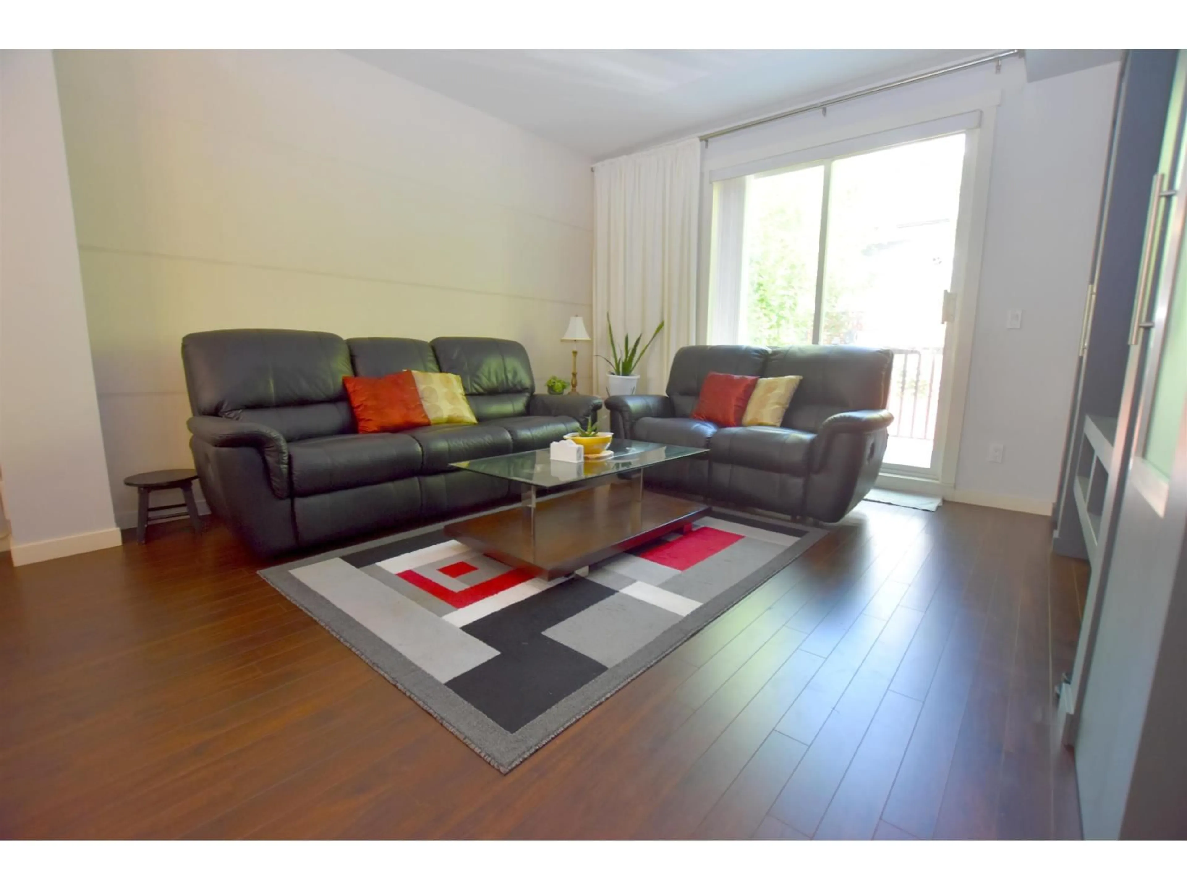 Living room with furniture, wood/laminate floor for 34 - 18983 72A, Surrey British Columbia V4N1A5