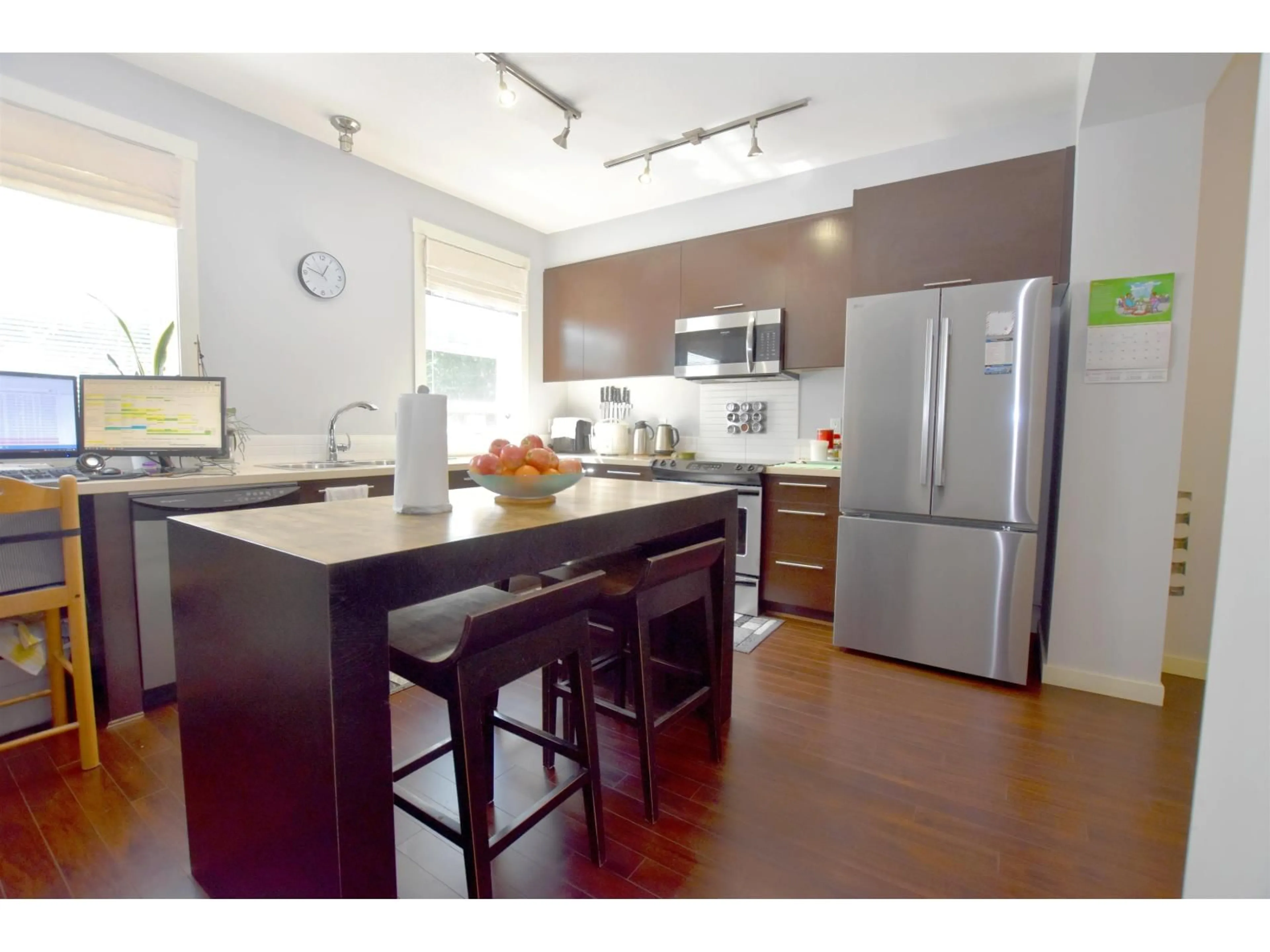 Open concept kitchen, wood/laminate floor for 34 - 18983 72A, Surrey British Columbia V4N1A5