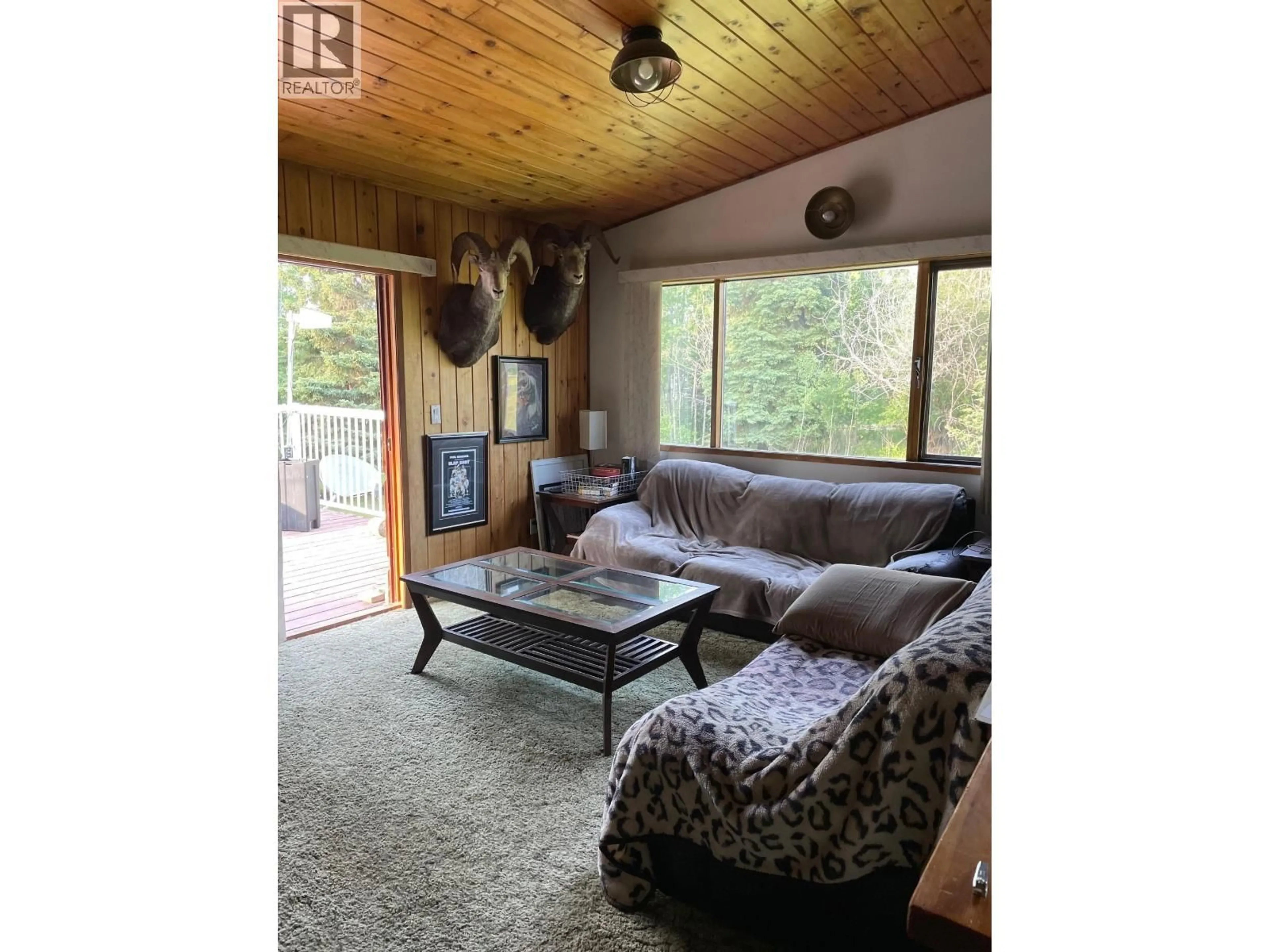 Living room with furniture, wood/laminate floor for 323 OAK ROAD, Vanderhoof British Columbia V0J3A2