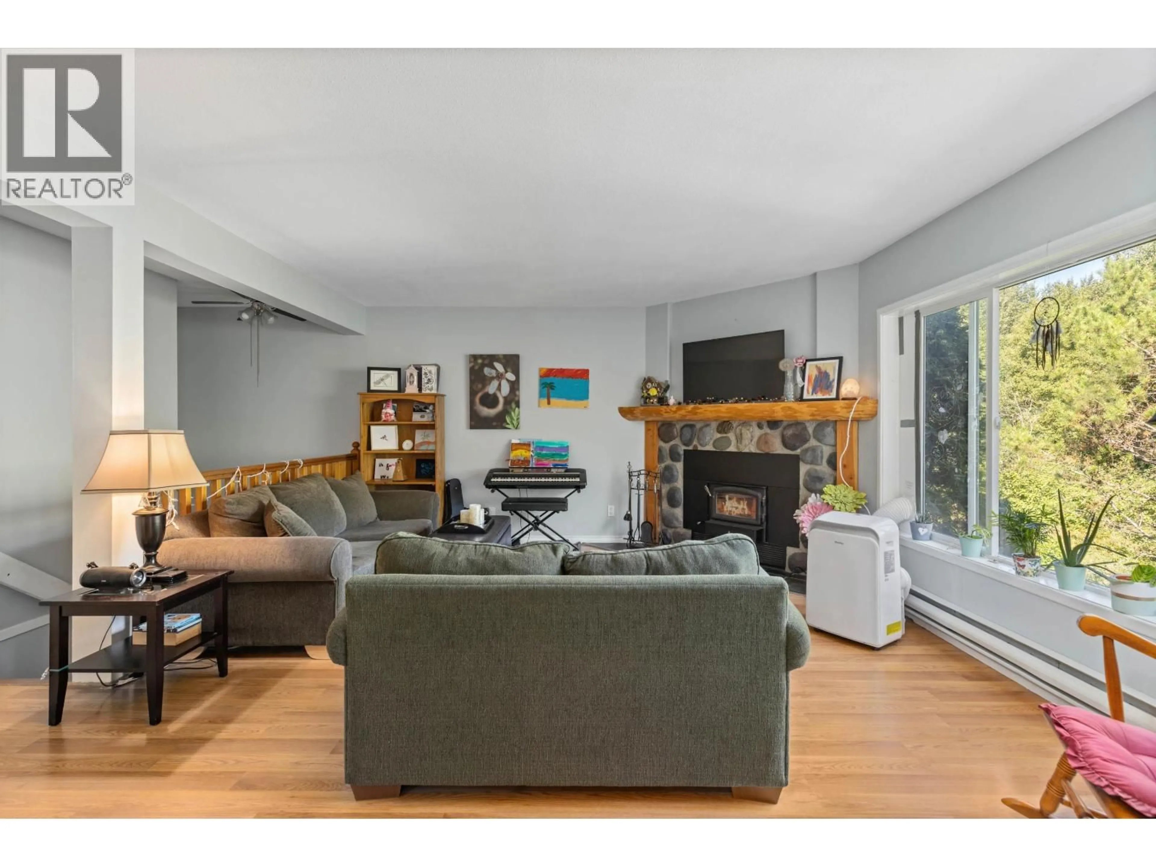 Living room with furniture, wood/laminate floor for 3 - 7467 PROSPECT STREET, Pemberton British Columbia V0N2L0