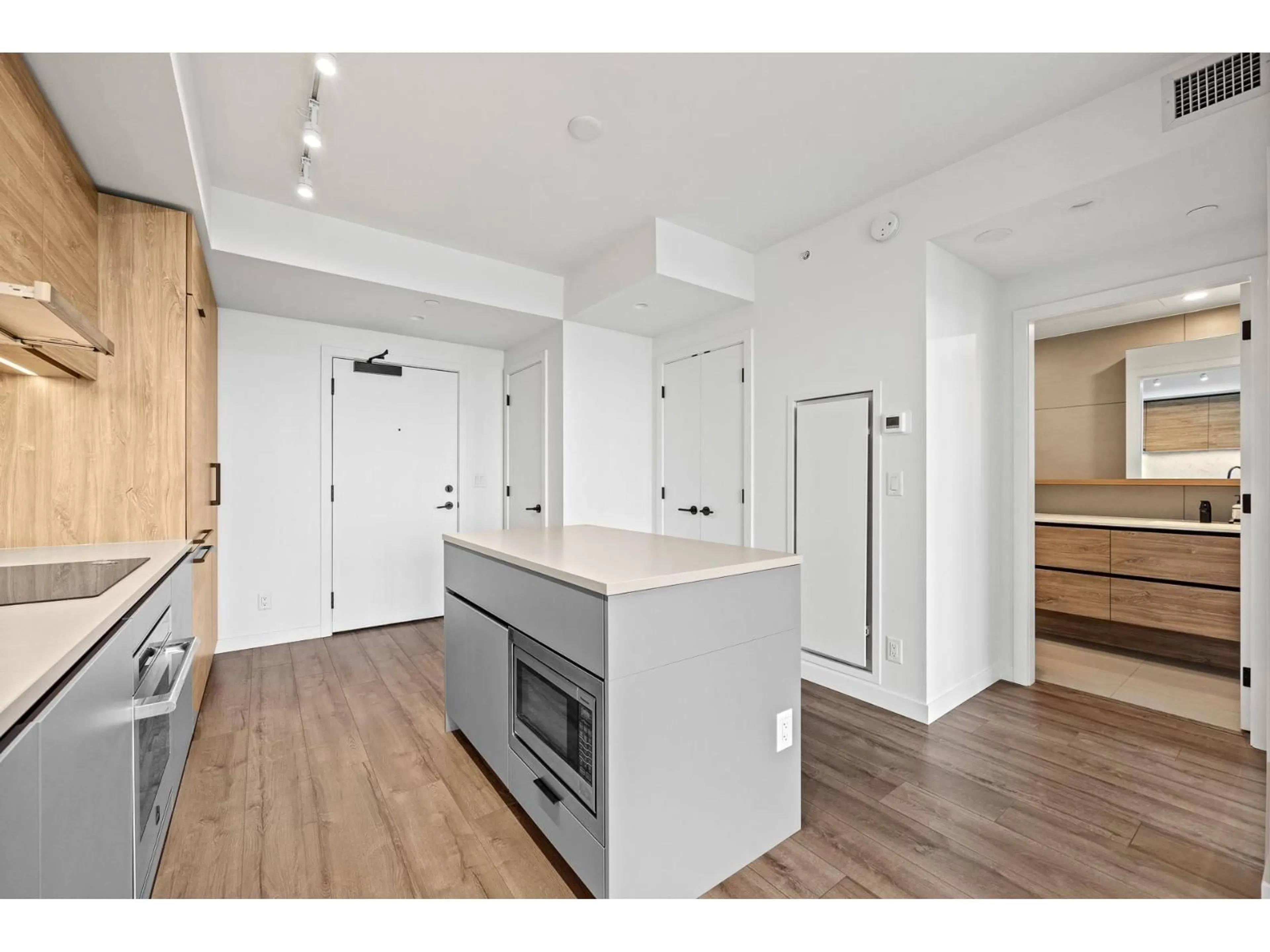 Open concept kitchen, wood/laminate floor for 2011 - 13428 105, Surrey British Columbia V3T0S6