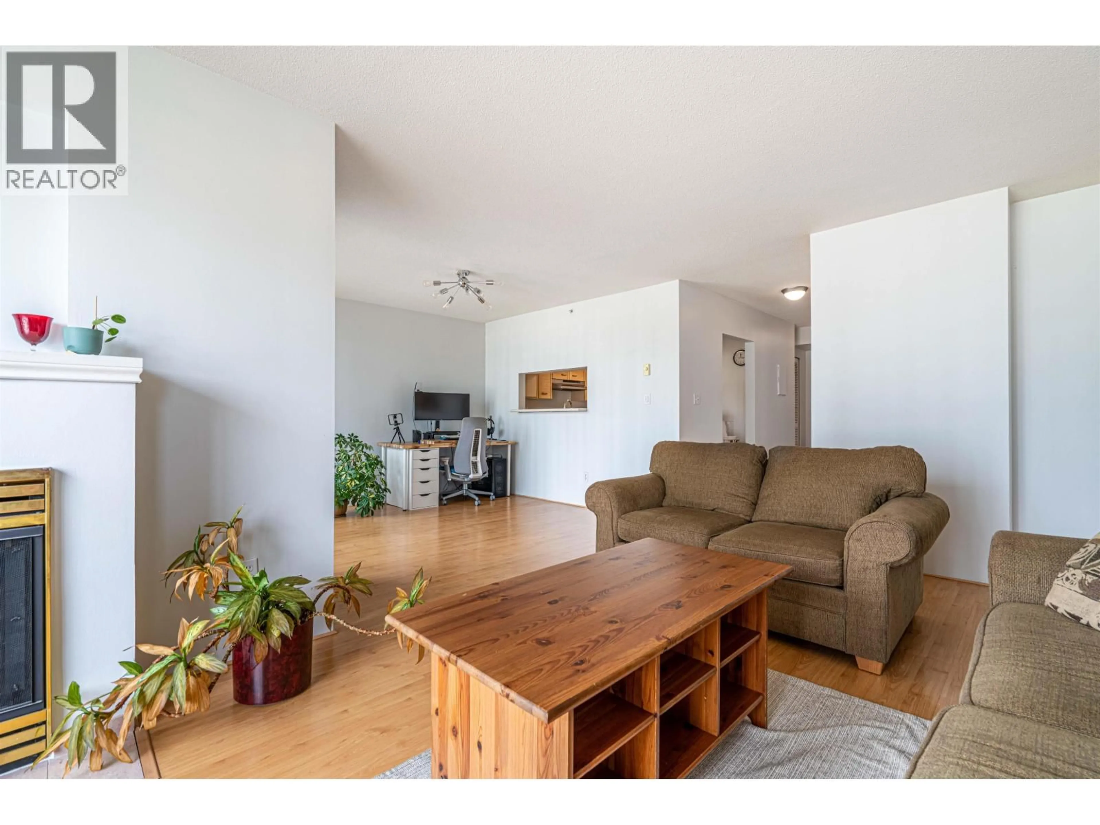 Living room with furniture, wood/laminate floor for 603 - 1180 PINETREE WAY, Coquitlam British Columbia V3B7L2