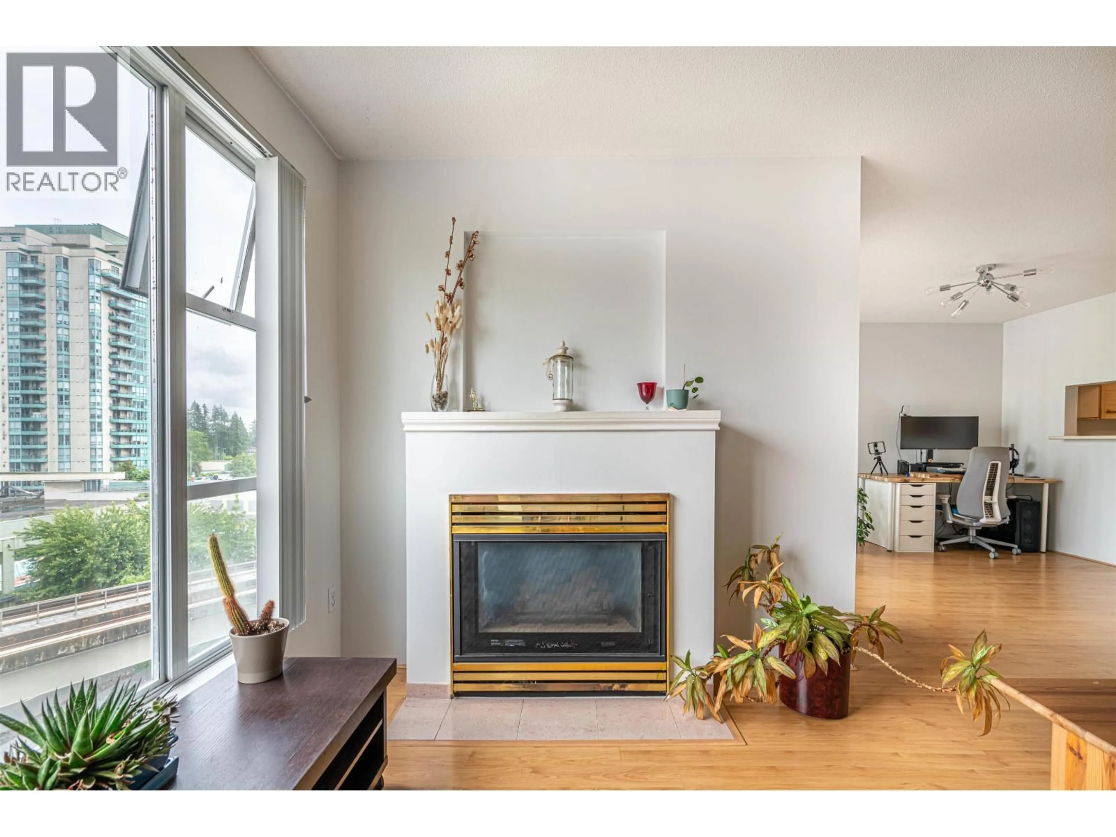 Living room with furniture, wood/laminate floor for 603 - 1180 PINETREE WAY, Coquitlam British Columbia V3B7L2