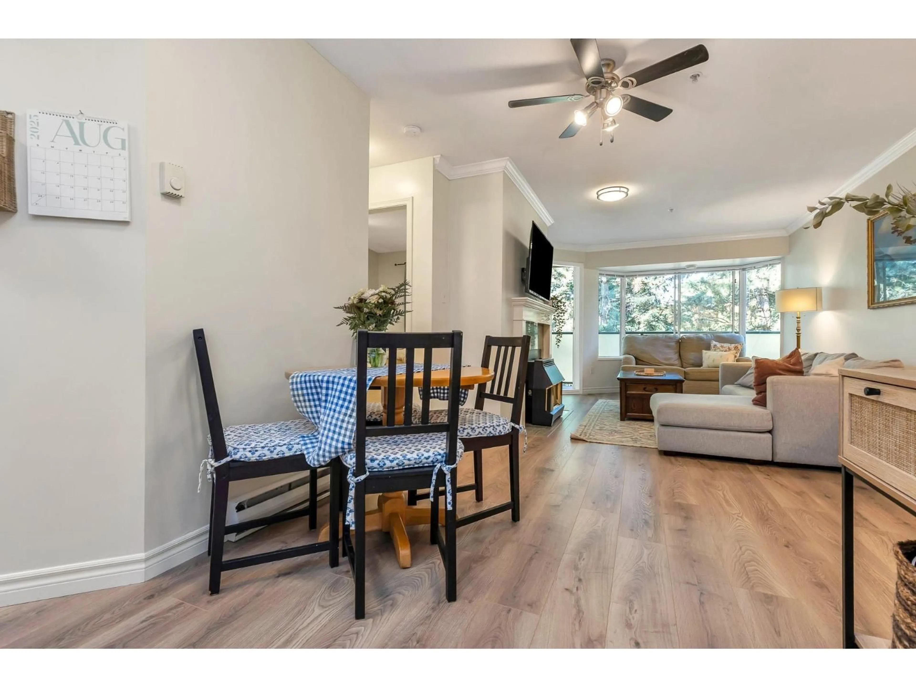 Living room with furniture, wood/laminate floor for 315 - 2964 TRETHEWEY, Abbotsford British Columbia V2T6P4