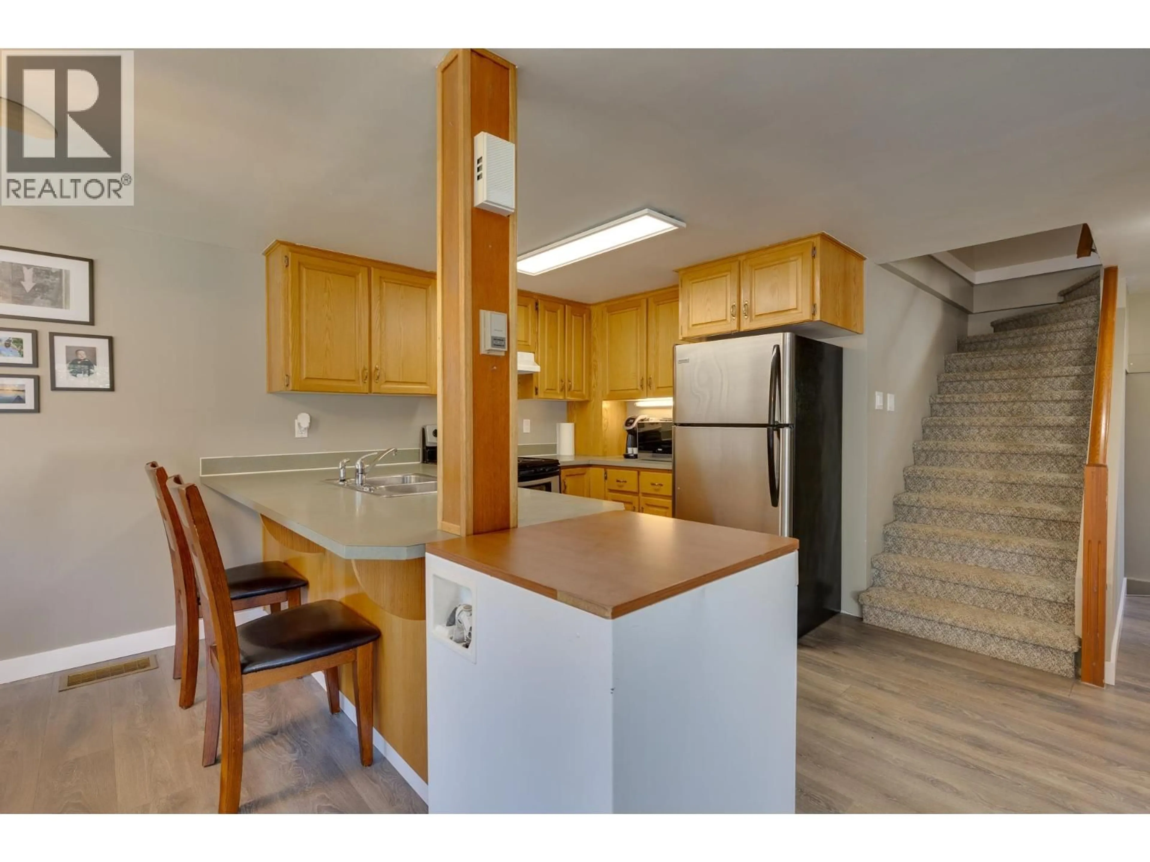 Open concept kitchen, wood/laminate floor for 2871 MEYER ROAD, Prince George British Columbia V2K1M2