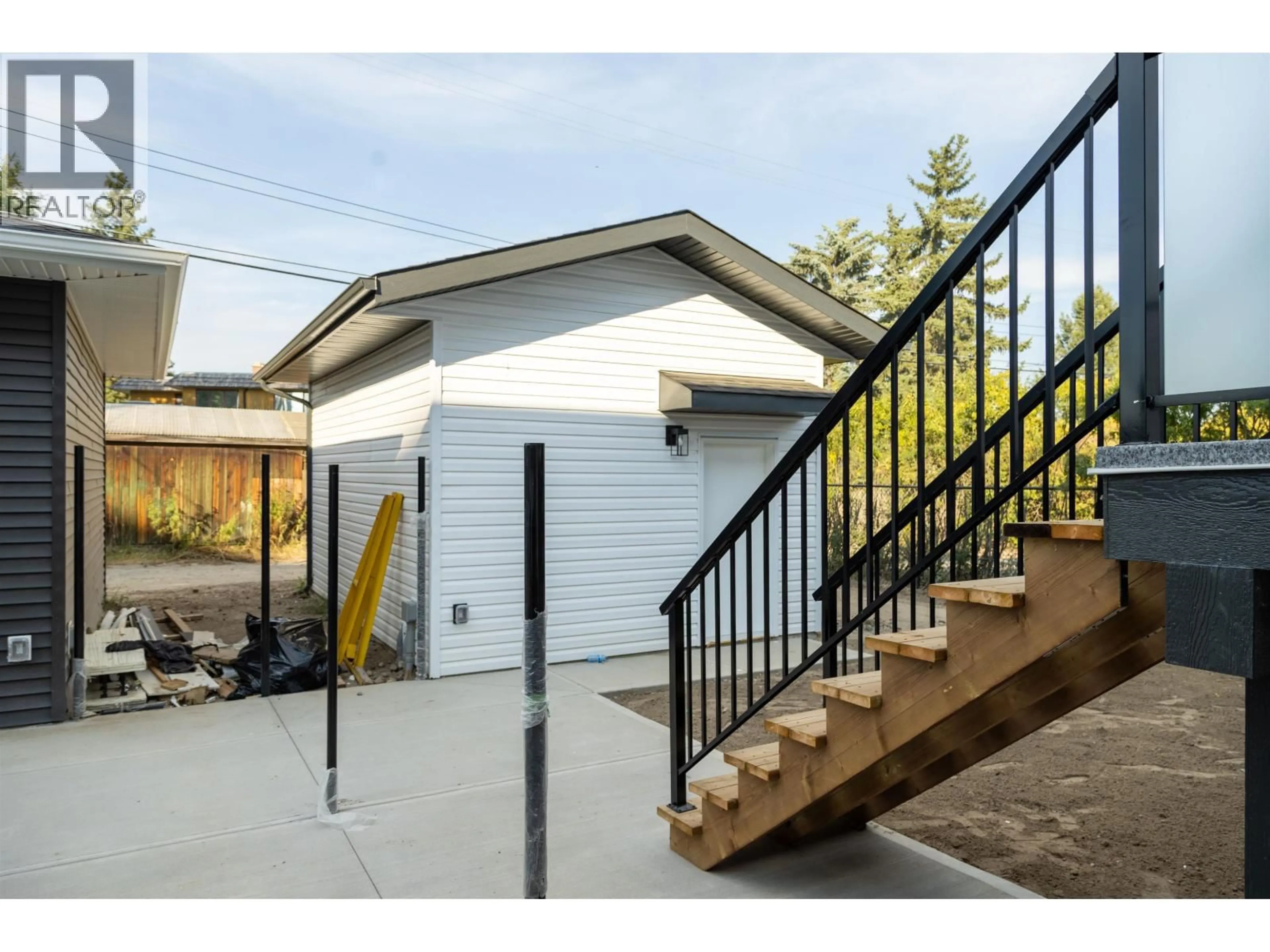 Home with vinyl exterior material, street for 1980 12TH AVENUE, Prince George British Columbia V2M1R9