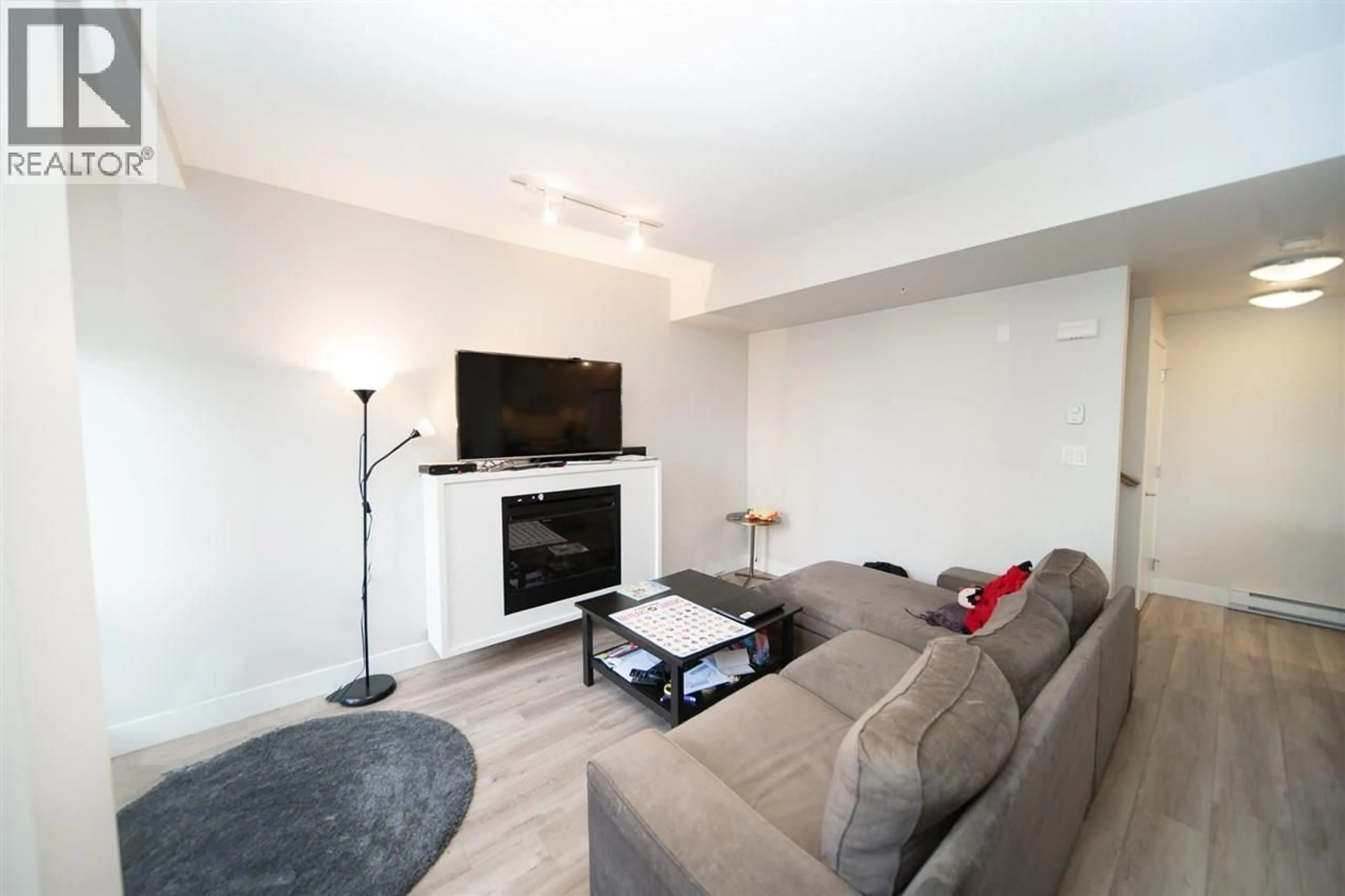 Living room with furniture, wood/laminate floor for 4848 HAZEL STREET, Burnaby British Columbia V5H4T3