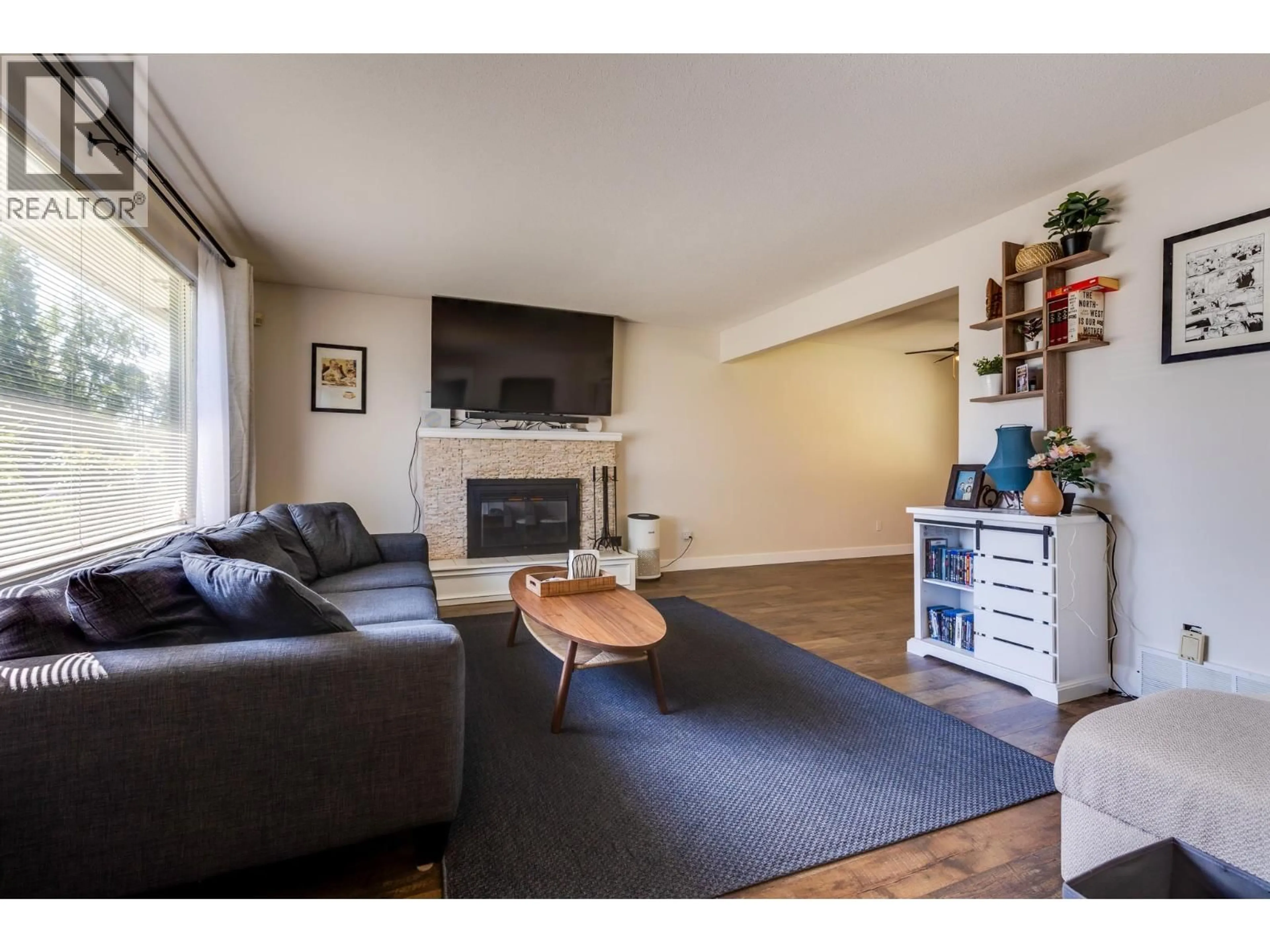 Living room with furniture, wood/laminate floor for 5463 SIMON FRASER AVENUE, Prince George British Columbia V2N2C1