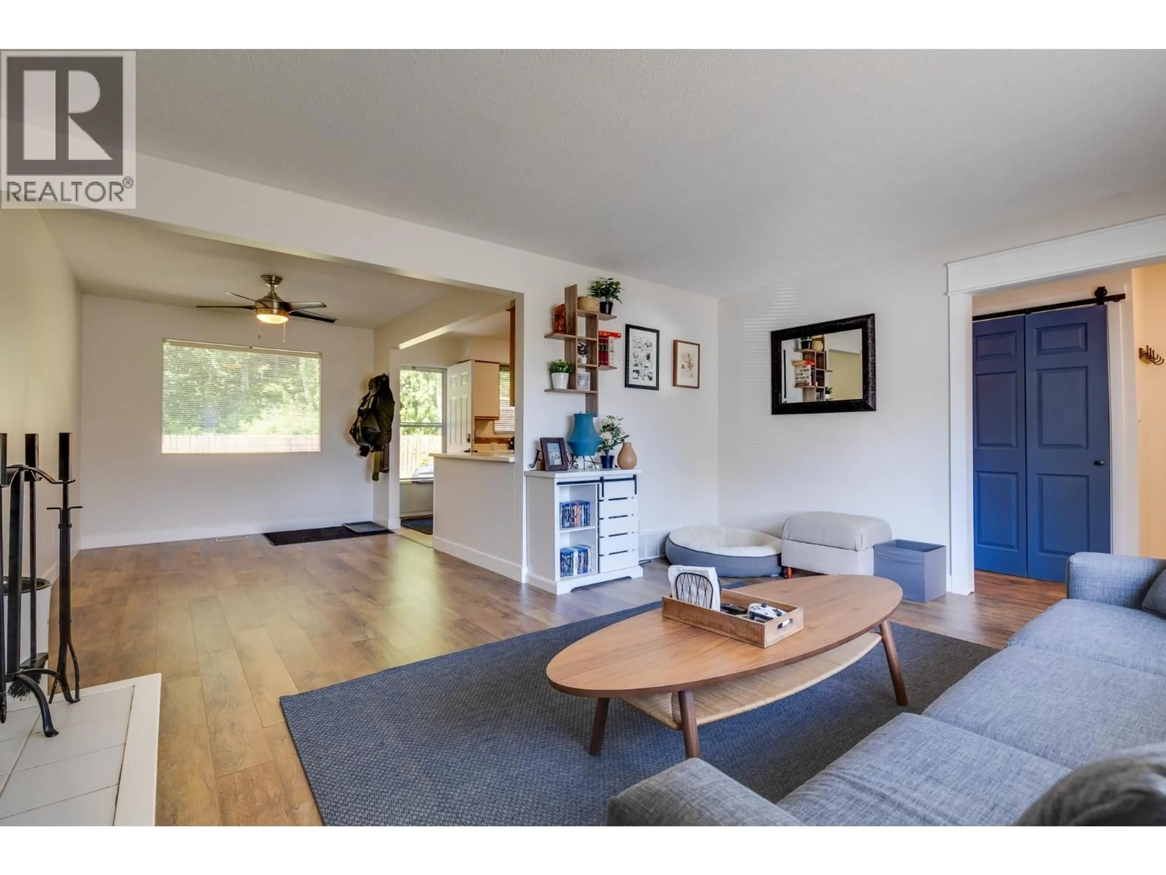 Living room with furniture, wood/laminate floor for 5463 SIMON FRASER AVENUE, Prince George British Columbia V2N2C1