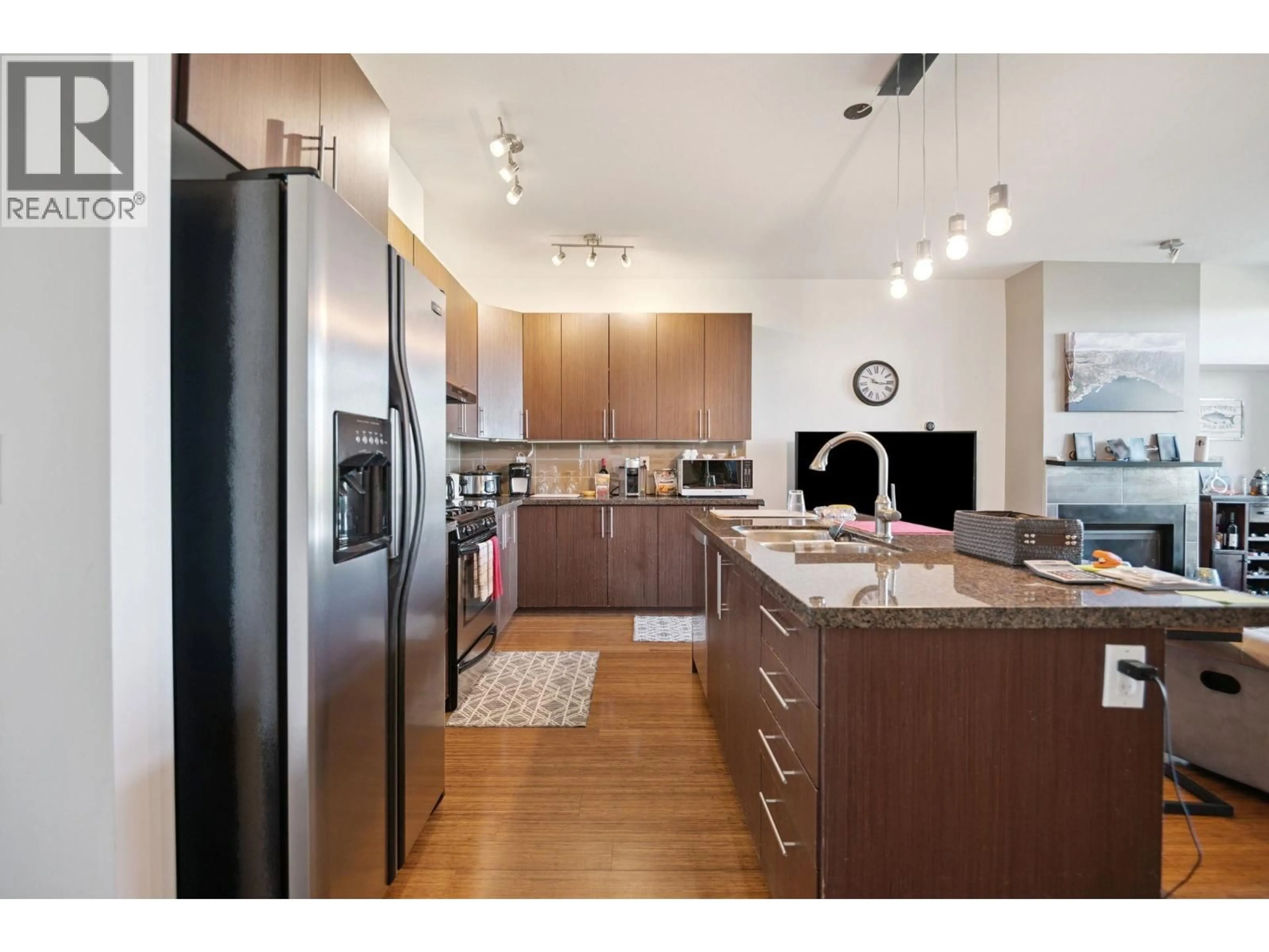 Open concept kitchen, wood/laminate floor for 206 - 6233 LONDON ROAD, Richmond British Columbia V7E3S3