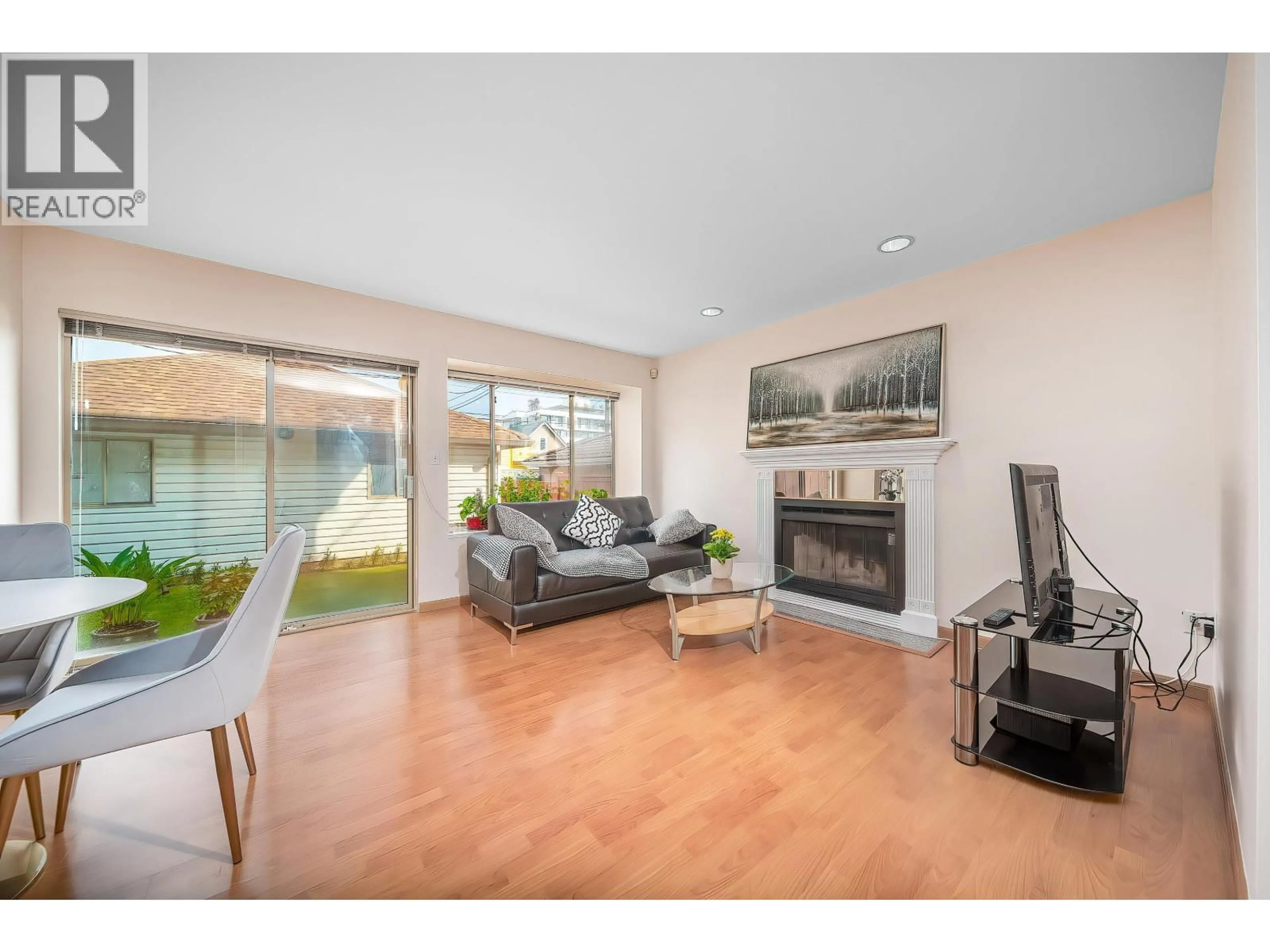 Living room with furniture, wood/laminate floor for 8328 OSLER STREET, Vancouver British Columbia V6P4E4