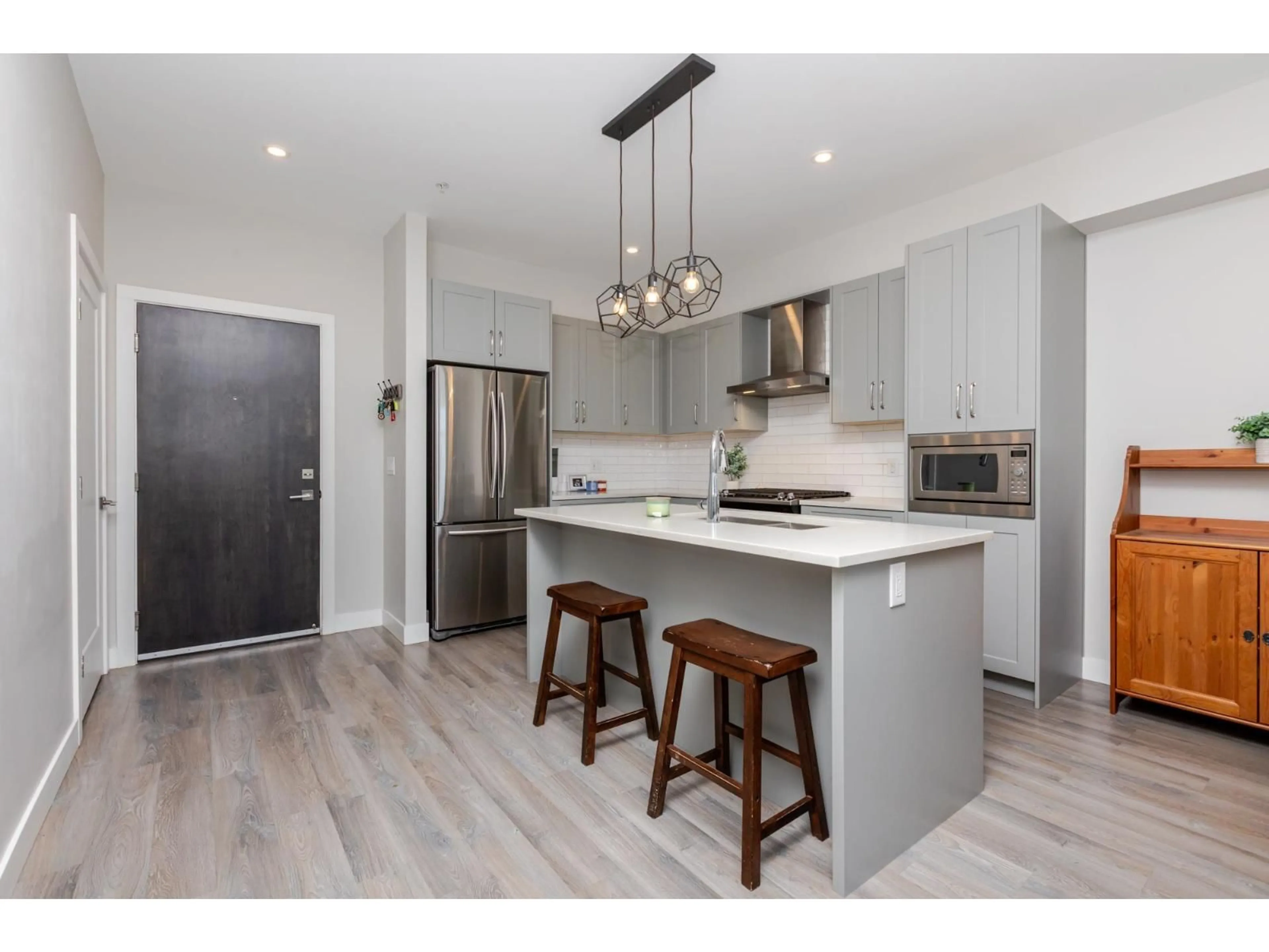 Open concept kitchen, wood/laminate floor for 505 - 15436 31, Surrey British Columbia V3Z1H3